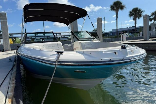 2022 Sea Ray SPX 210 Outboard boat docked in sunny marina.