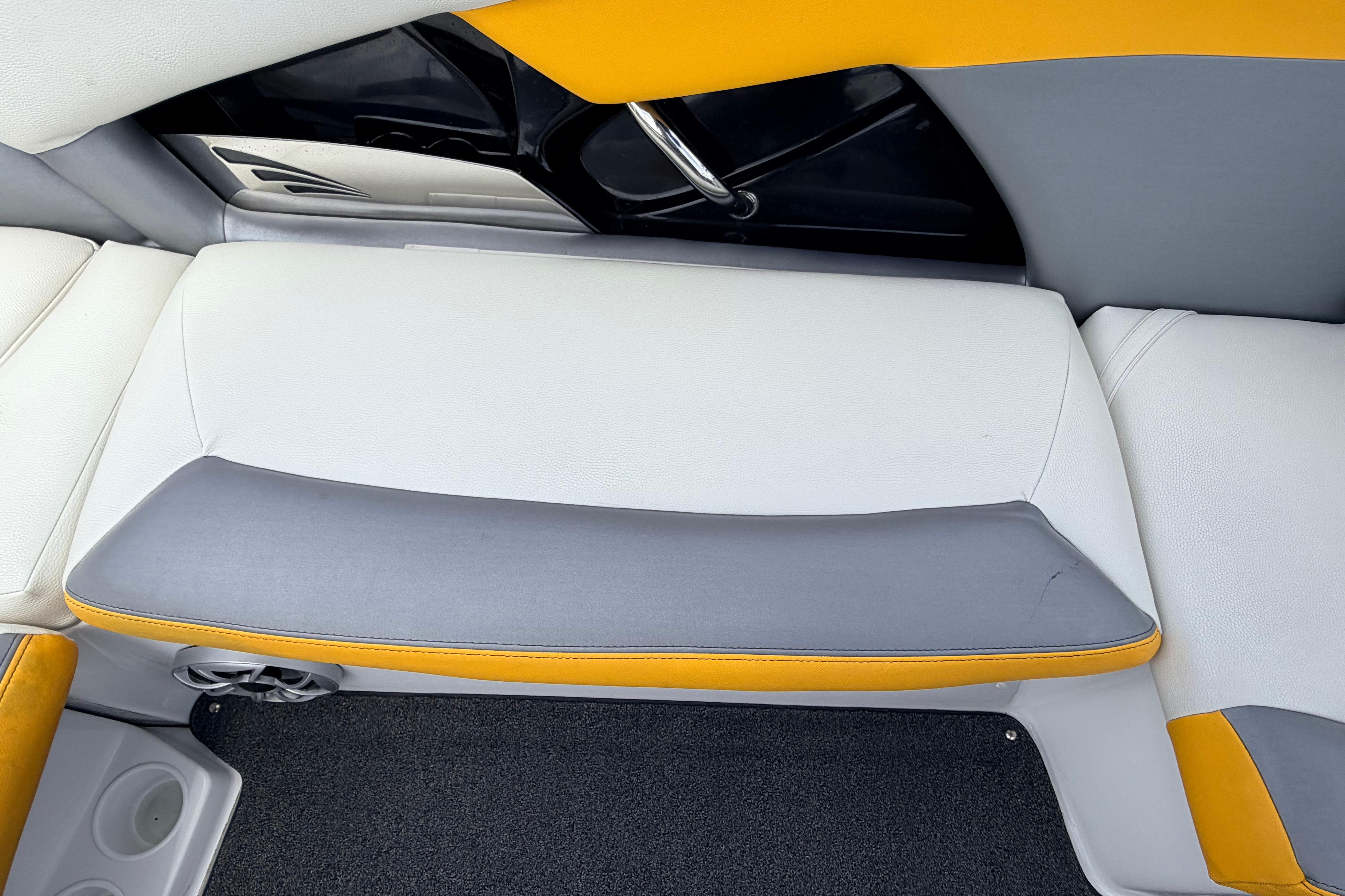 2014 Tigé R20 boat interior with gray and yellow seating.