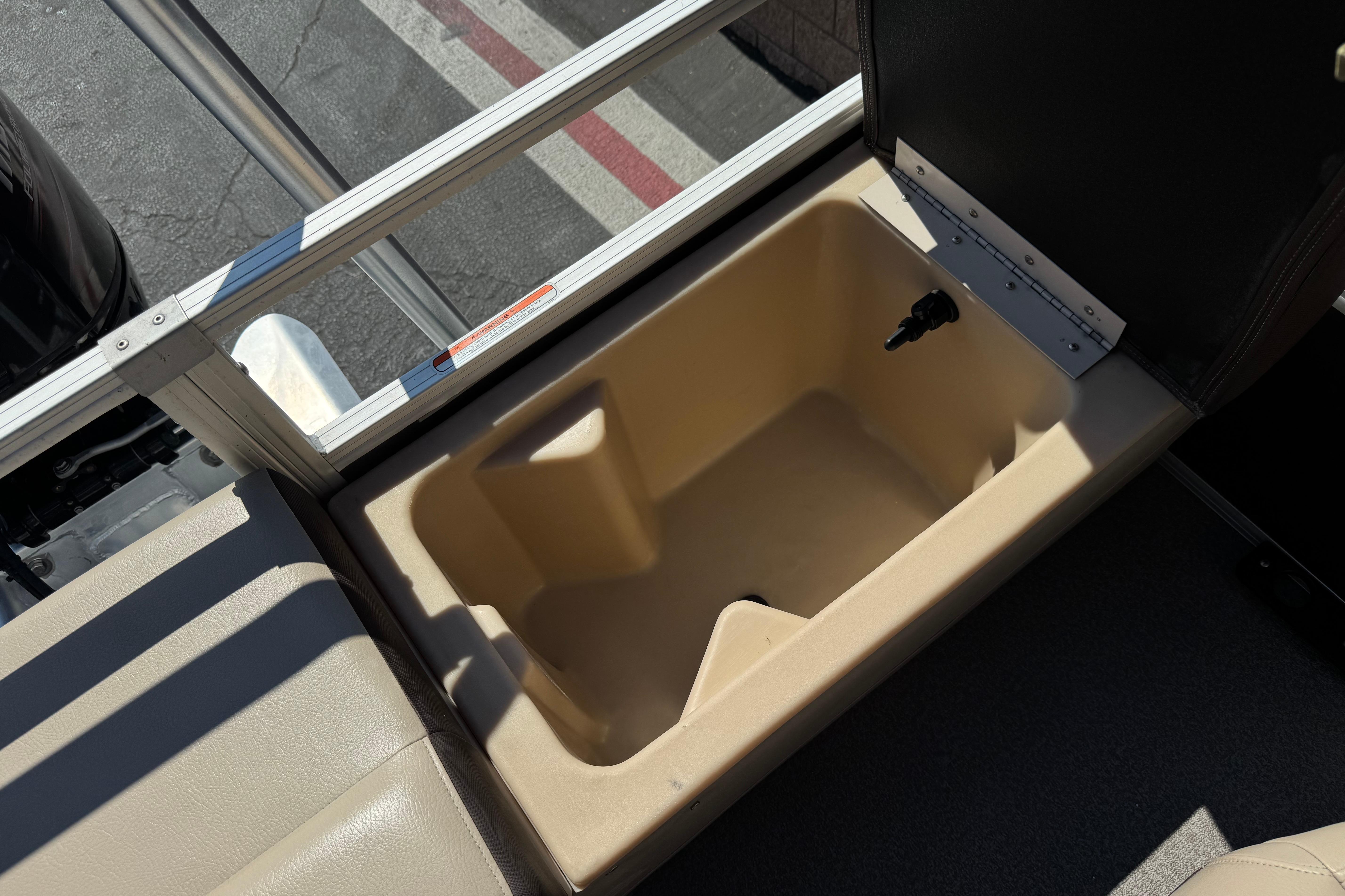 Open storage compartment on 2018 Sun Tracker SportFish 22 DLX boat.