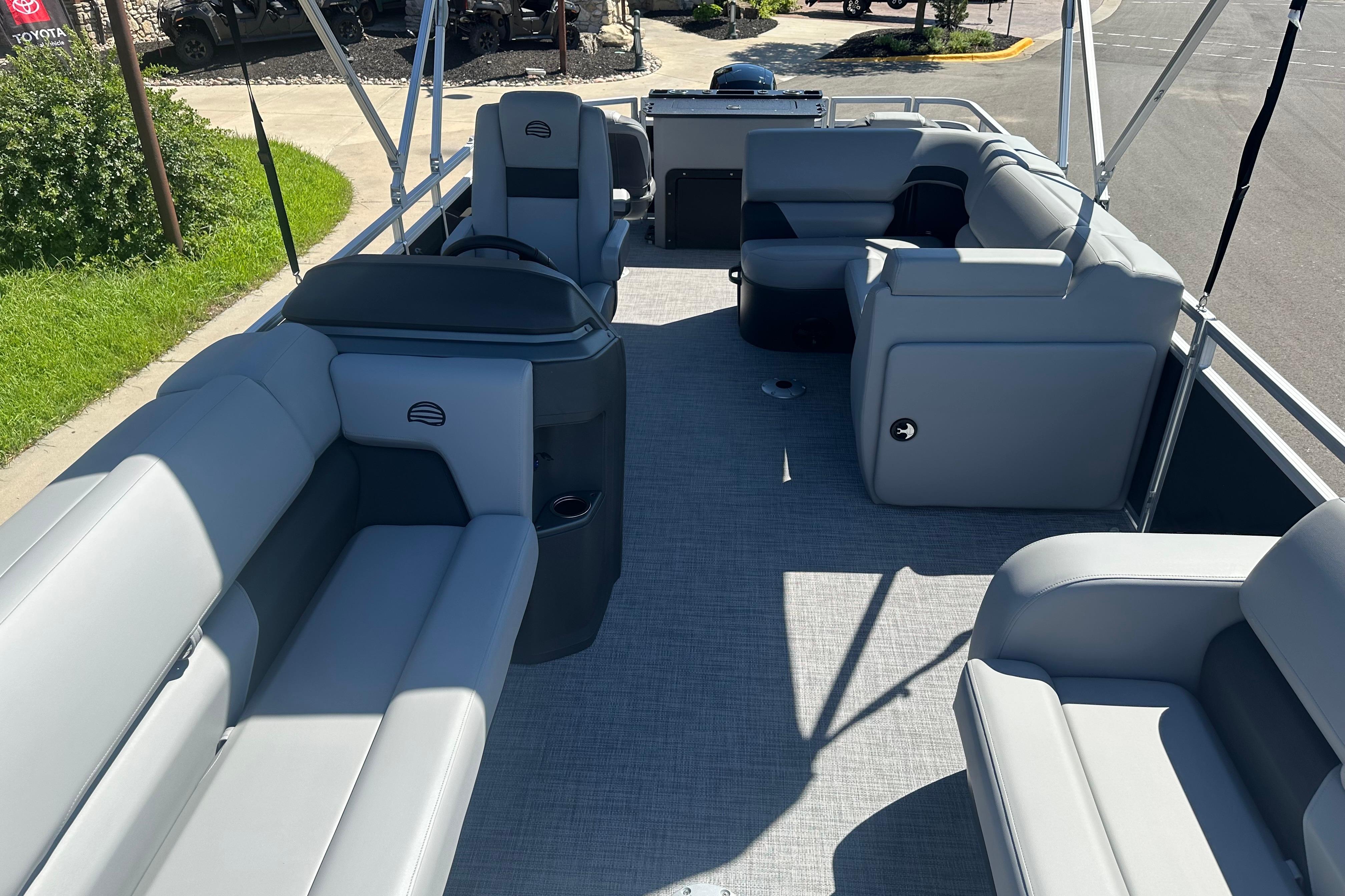 2026 Sun Tracker SportFish 22 DLX pontoon boat with spacious seating and modern design.