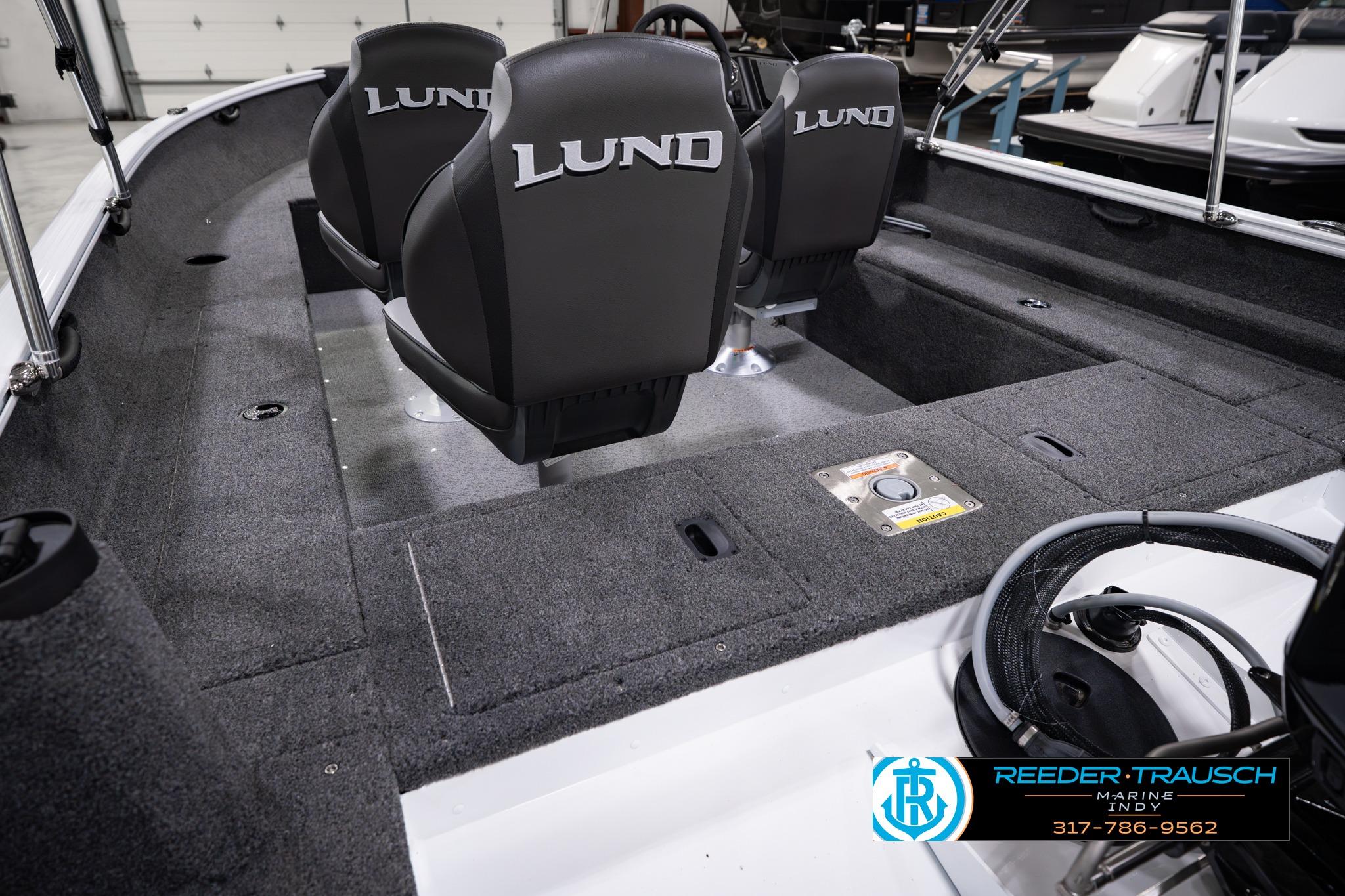 2026 Lund 1650 Rebel XL SS boat interior with branded seats and carpeted flooring.