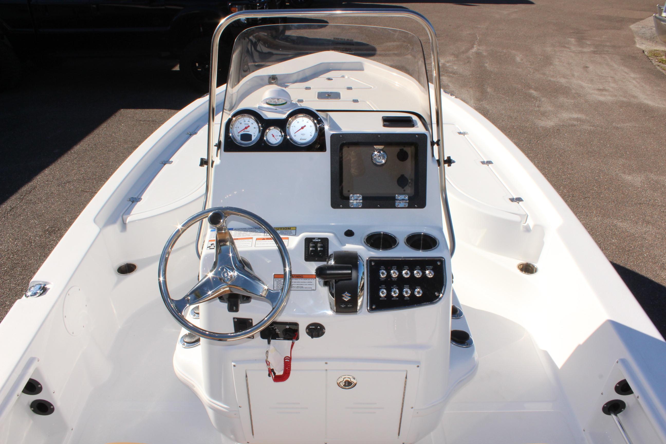 2025 NauticStar 214 Shallow Bay boat dashboard with steering wheel and gauges.