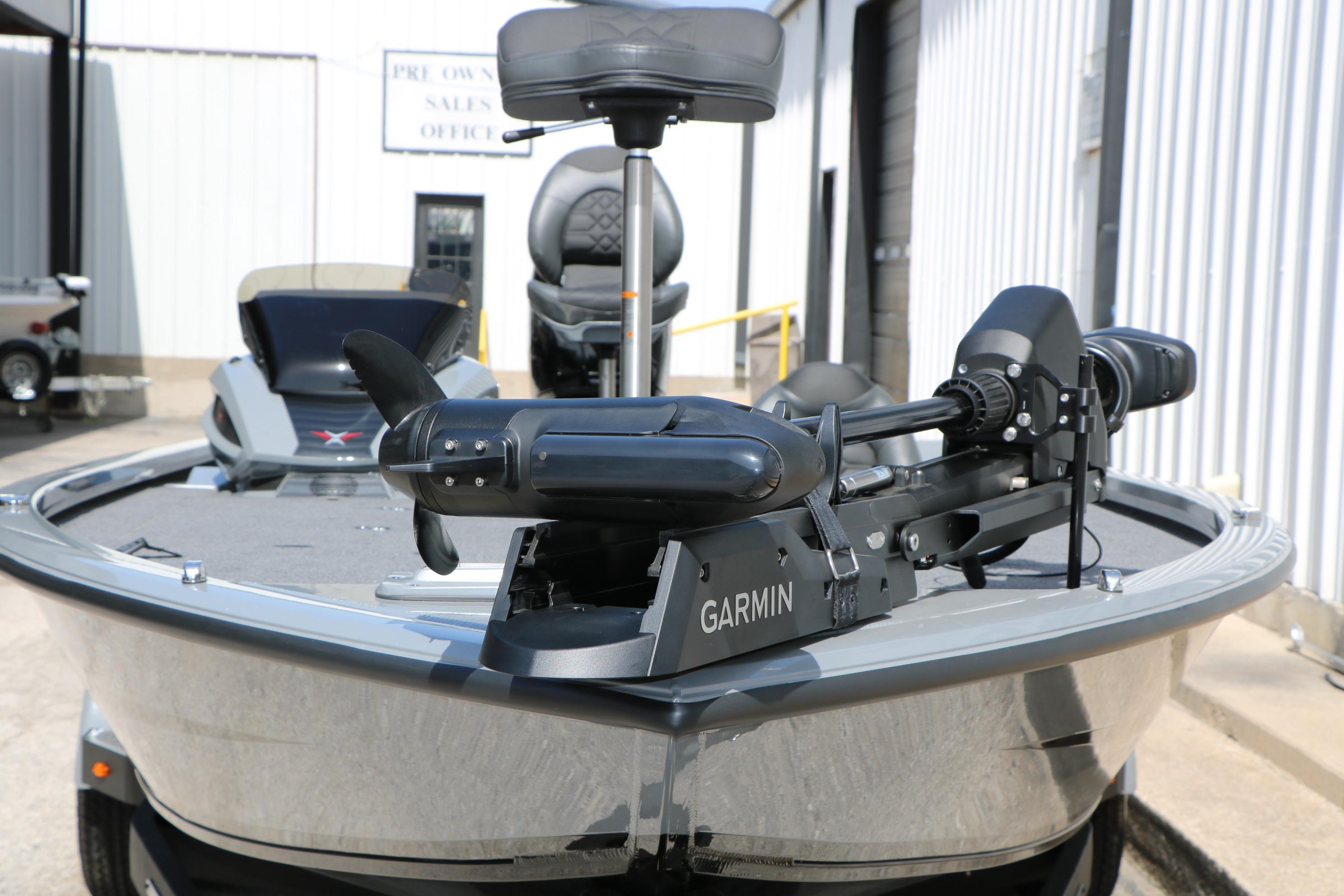 2026 Vexus AVX1980 boat with Garmin equipment, parked outside a sales office.