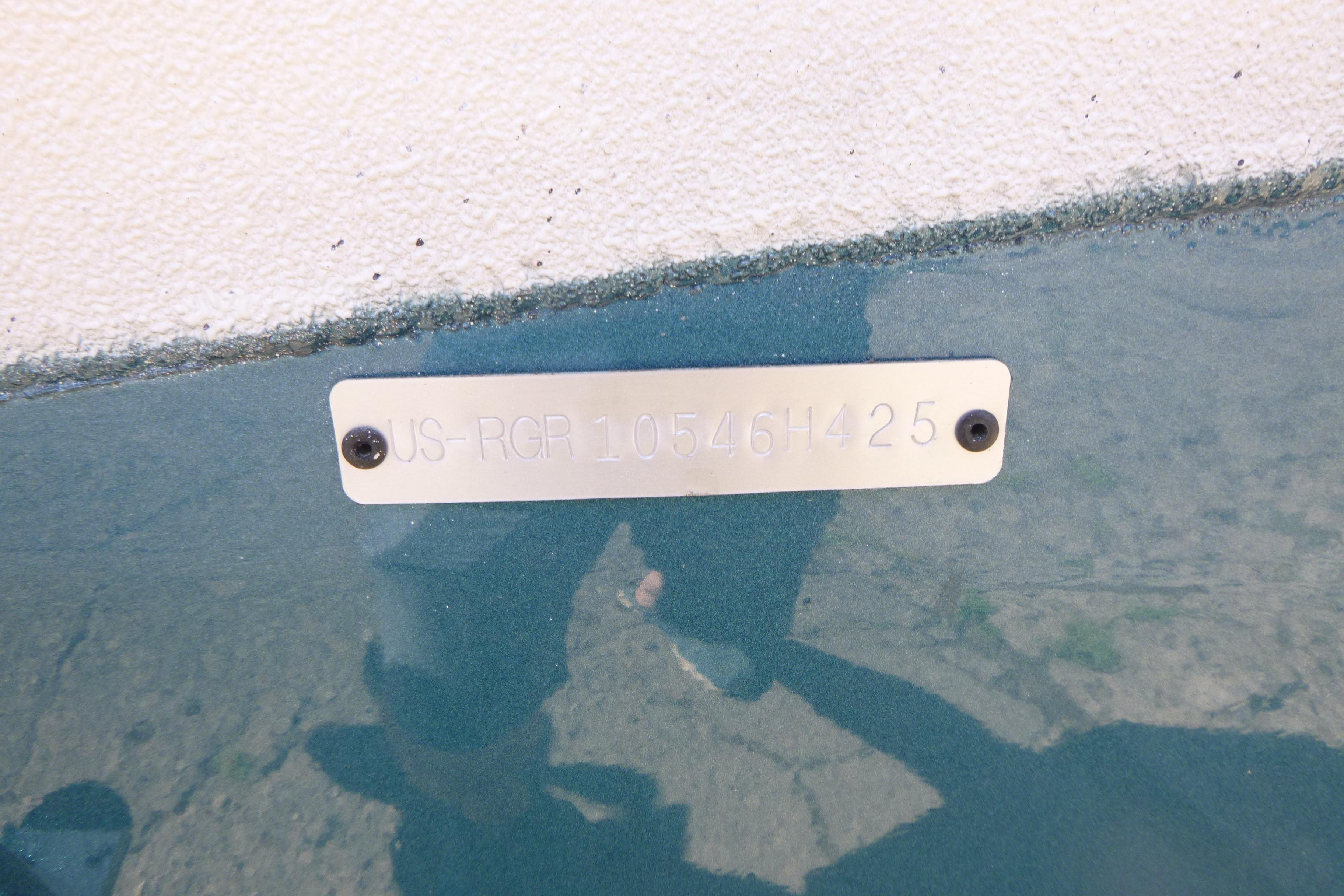 Ranger RB210 2025 model identification plate with serial number on a textured surface.