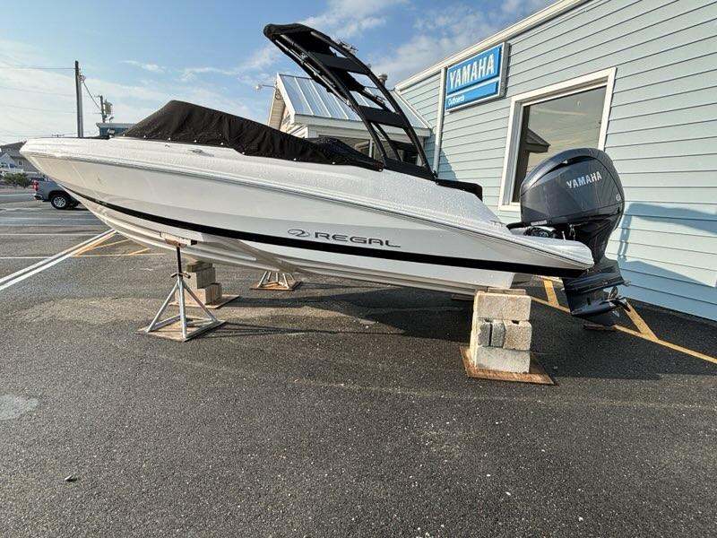 2026 Regal 21 OBX boat on display with Yamaha outboard motor.
