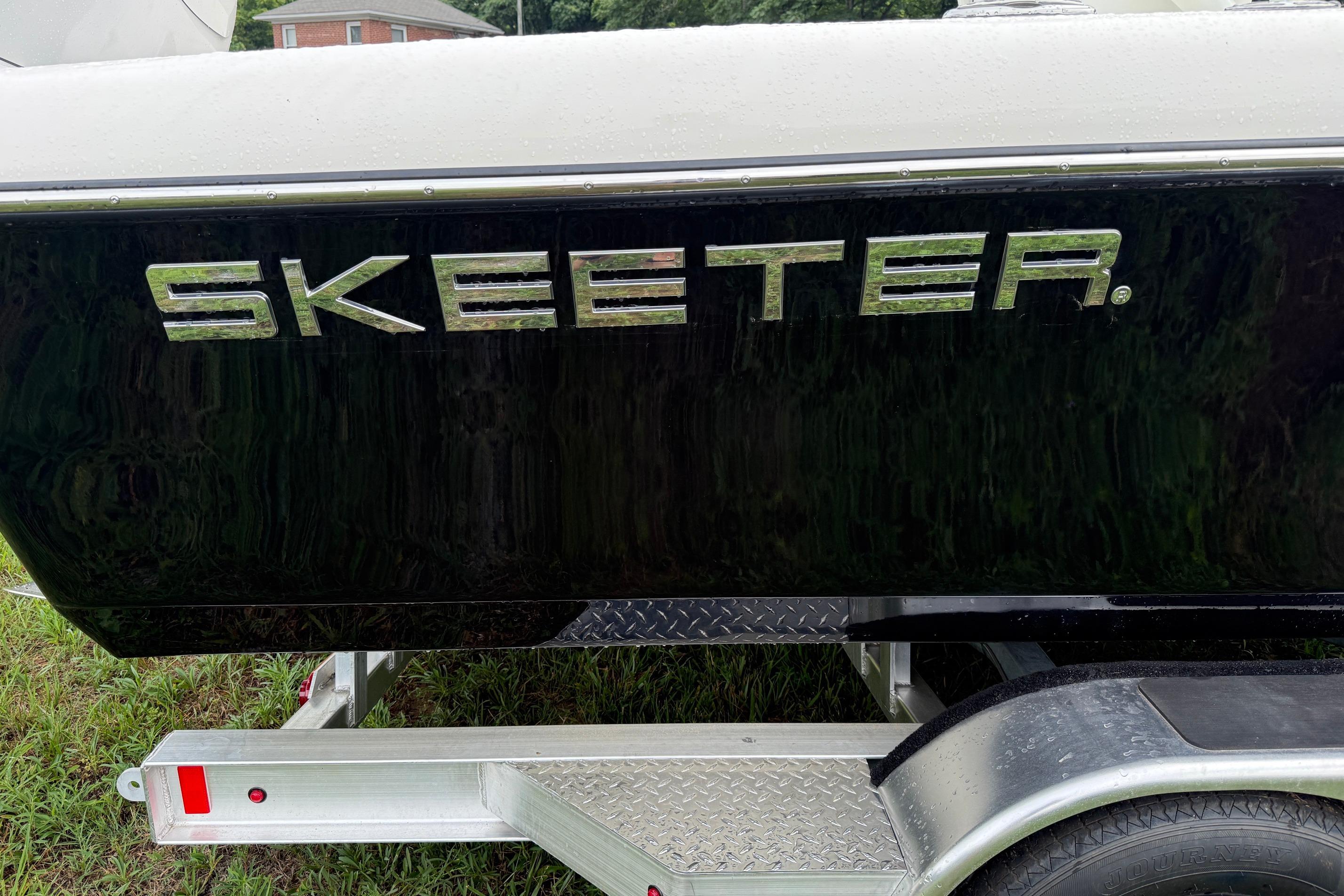 2026 Skeeter SX2350 boat on trailer, showcasing sleek black exterior design.