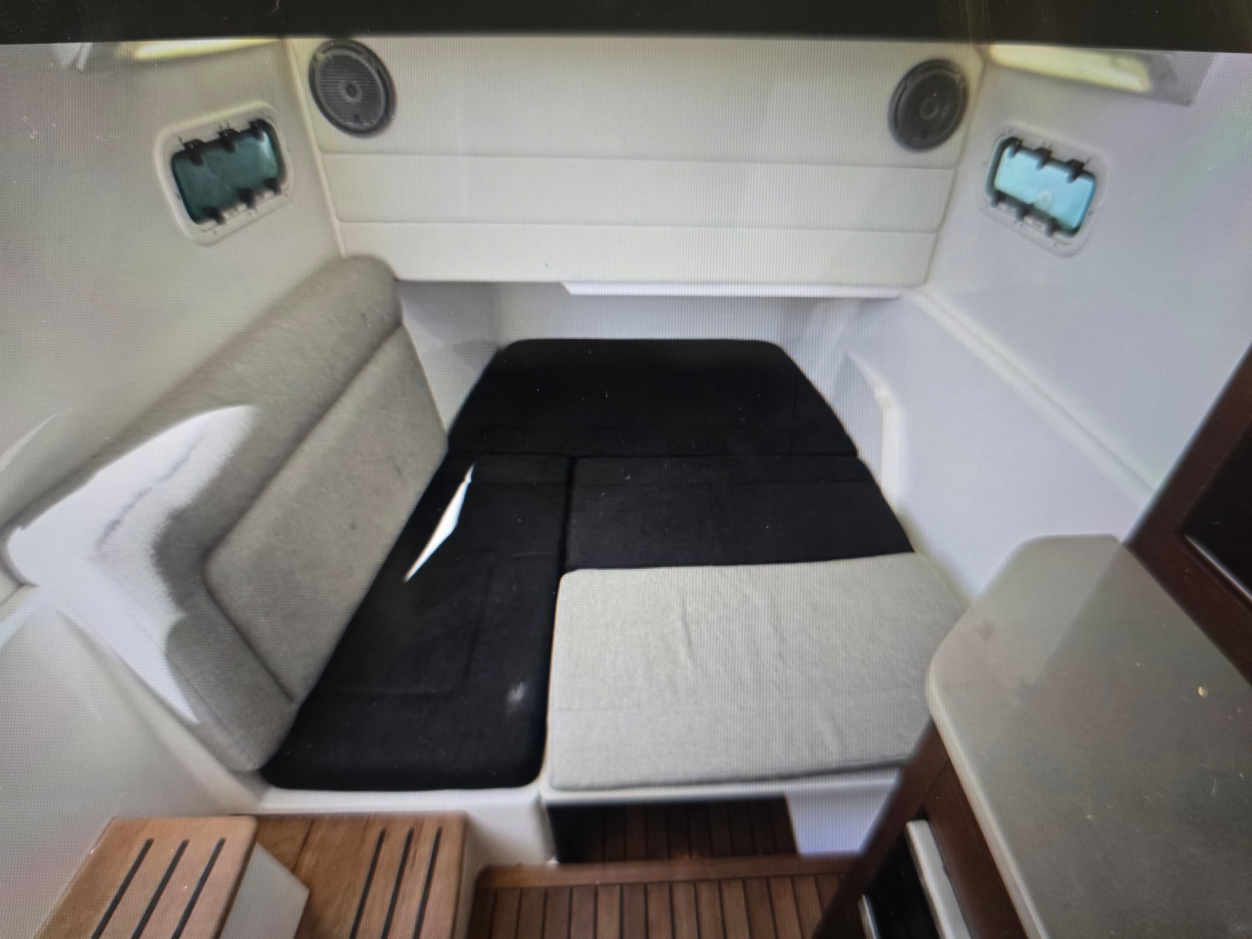 Interior of 2019 Everglades 435 Center Console with seating area.