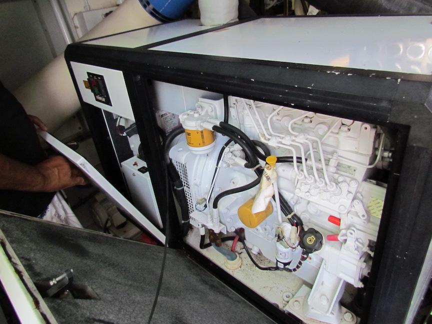 Engine compartment of a 1972 Hargrave 67 Motor Yacht, showcasing mechanical components.