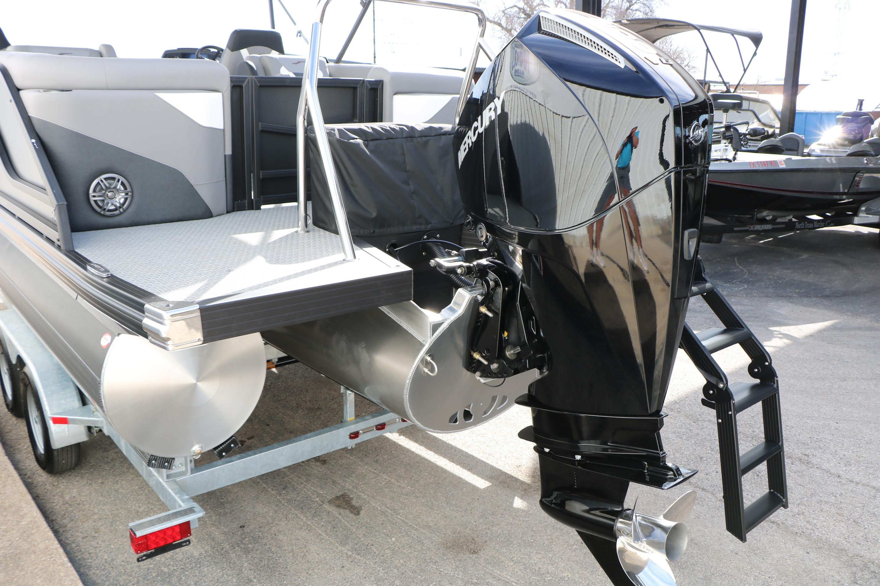 2026 Evotti 521QL boat with Mercury outboard motor on trailer.