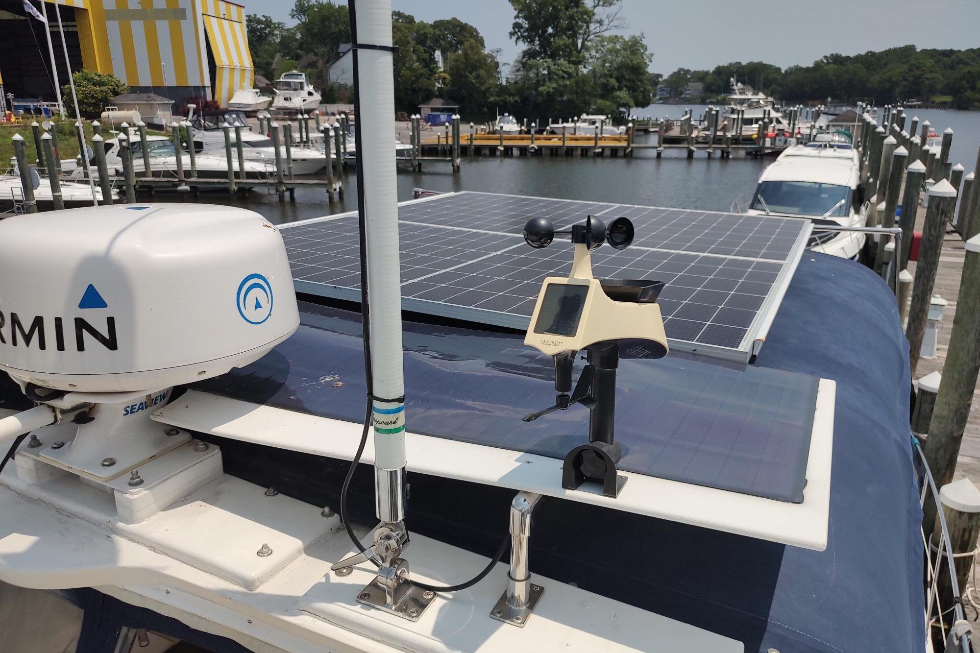 1989 Hyatt Double Cabin Motoryacht with solar panels and Garmin equipment docked at a marina.