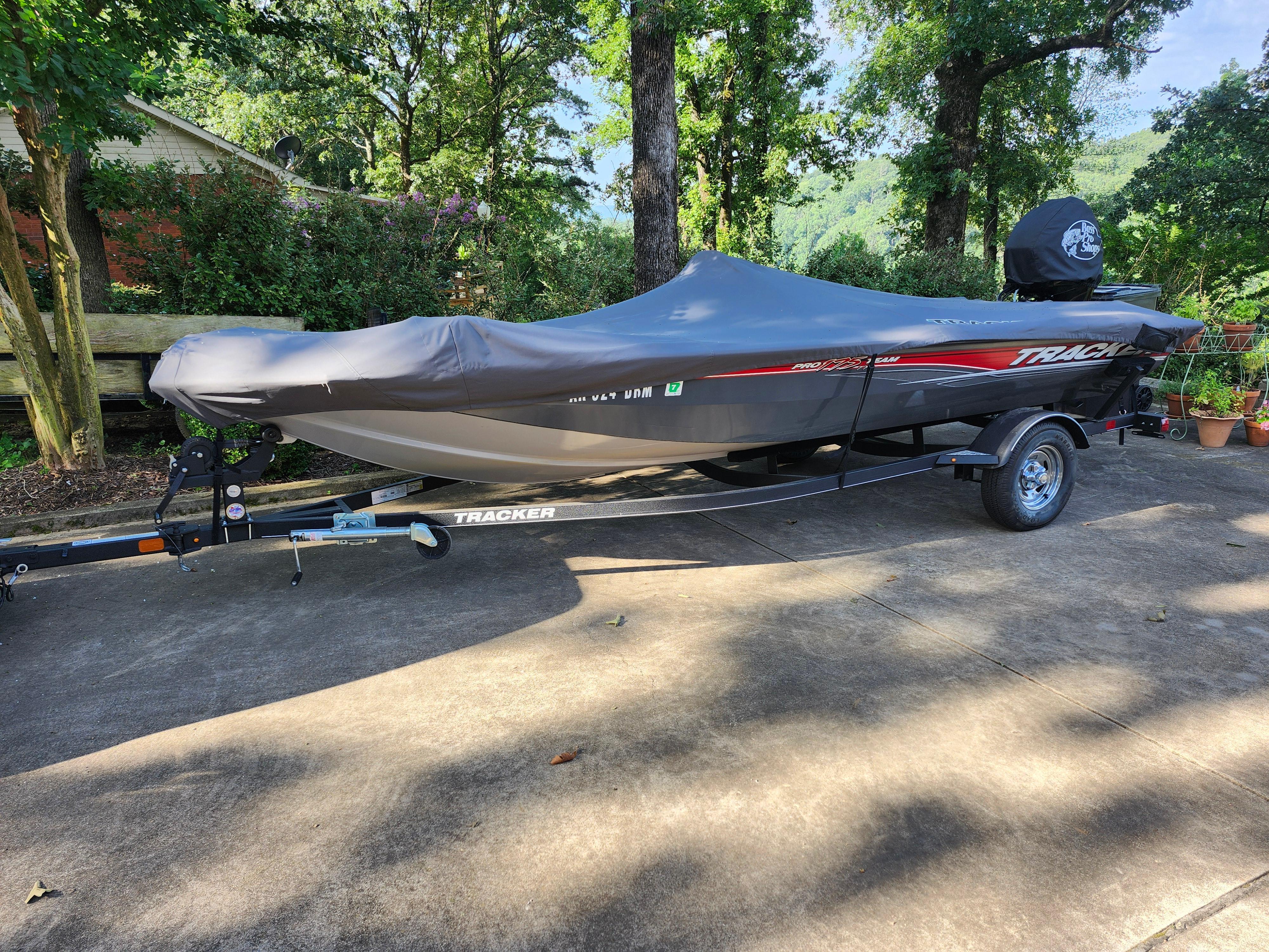 2018 Tracker Pro 175 TF boat covered on trailer, parked on driveway.