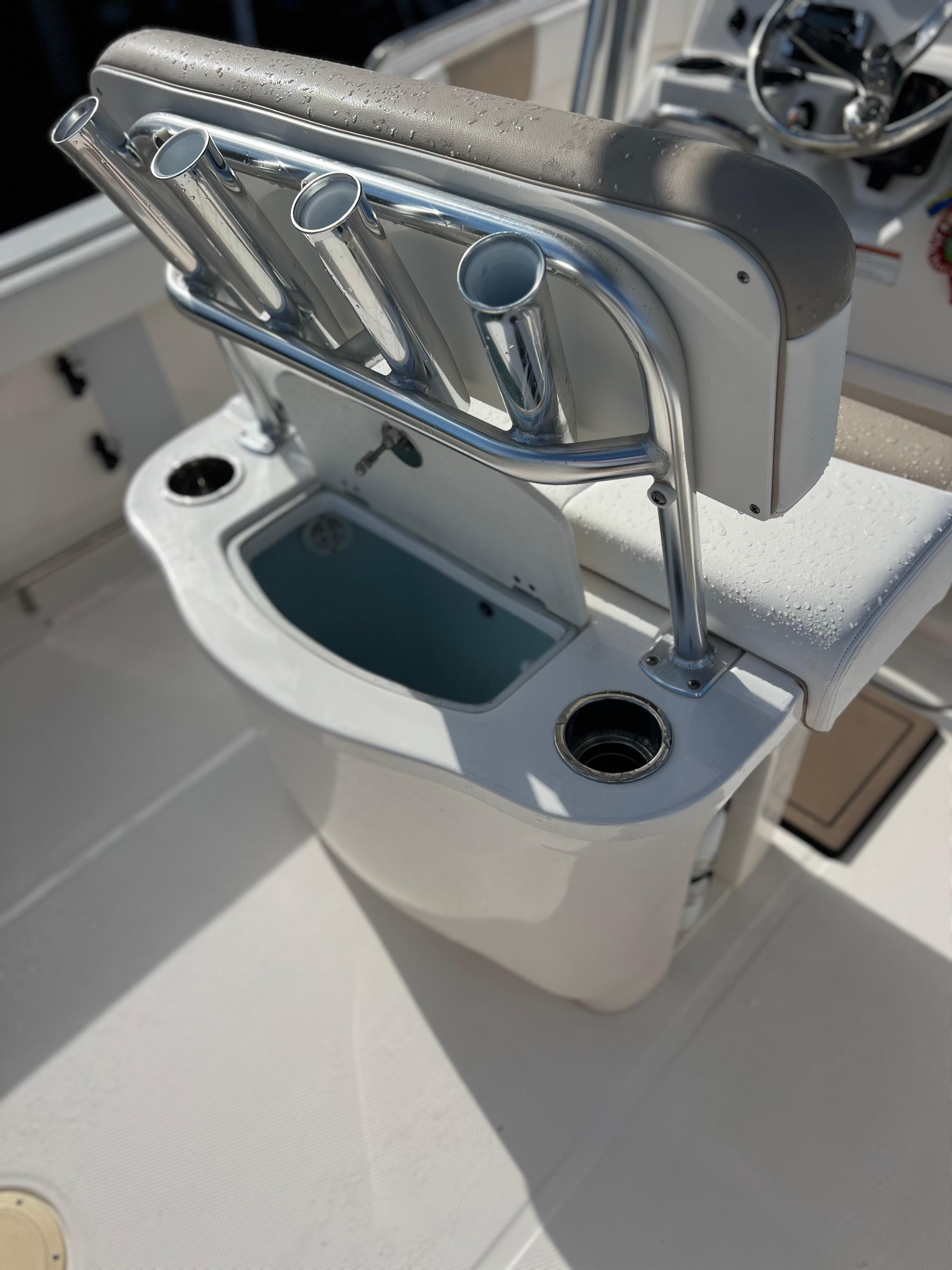 2022 Robalo R222 Center Console boat with rod holders and livewell.