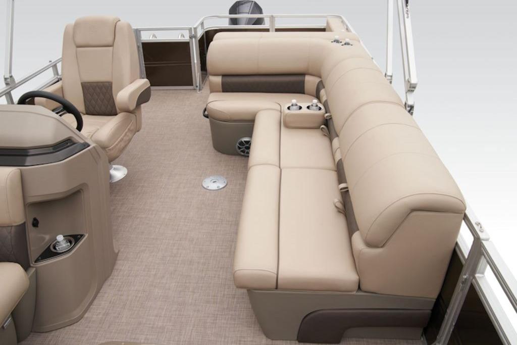 2025 Sun Tracker Sportfish™ 24 XP3 interior with beige seating and steering console.