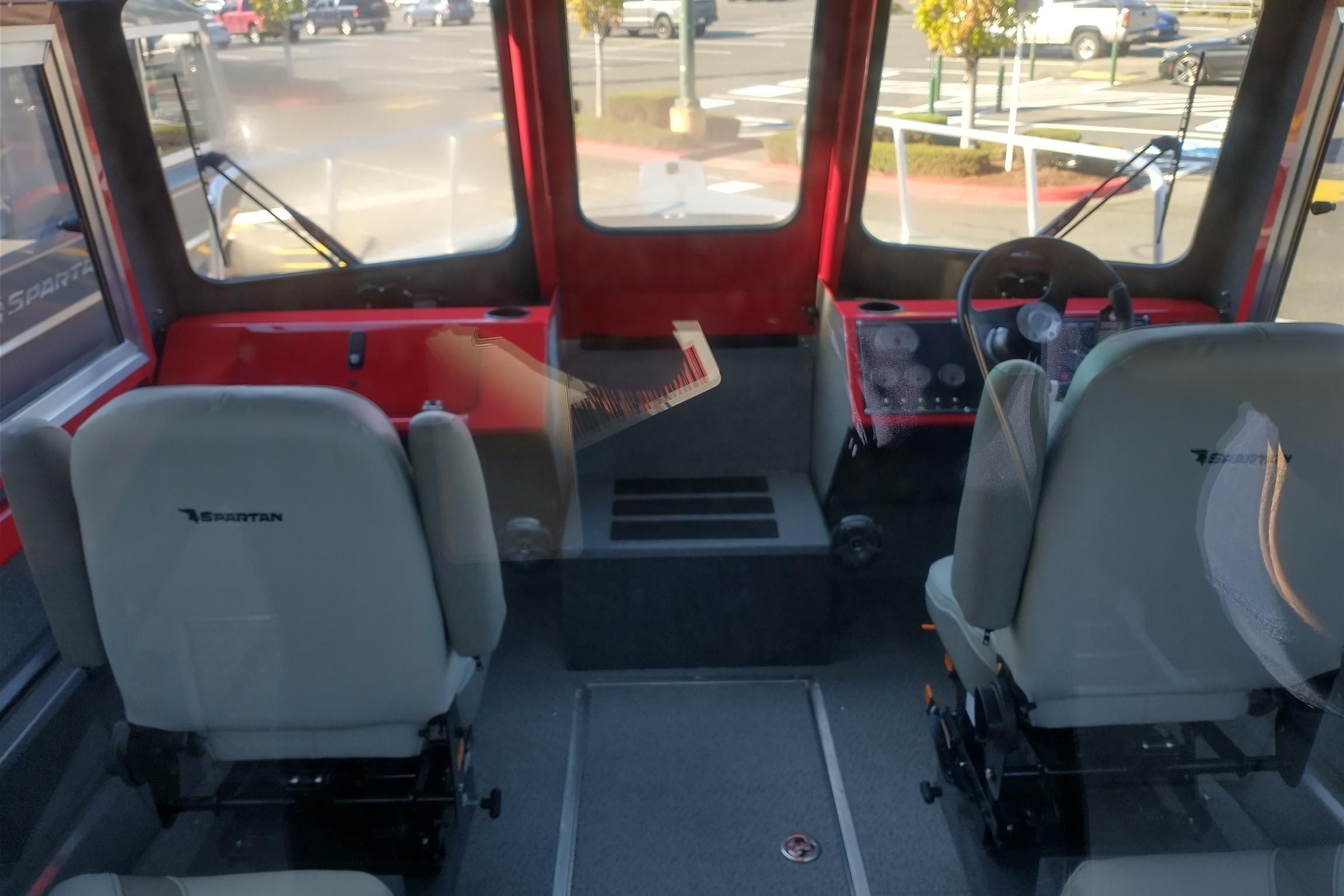 Interior of 2024 Spartan 220 Maximus Pro with dual seats and dashboard view.