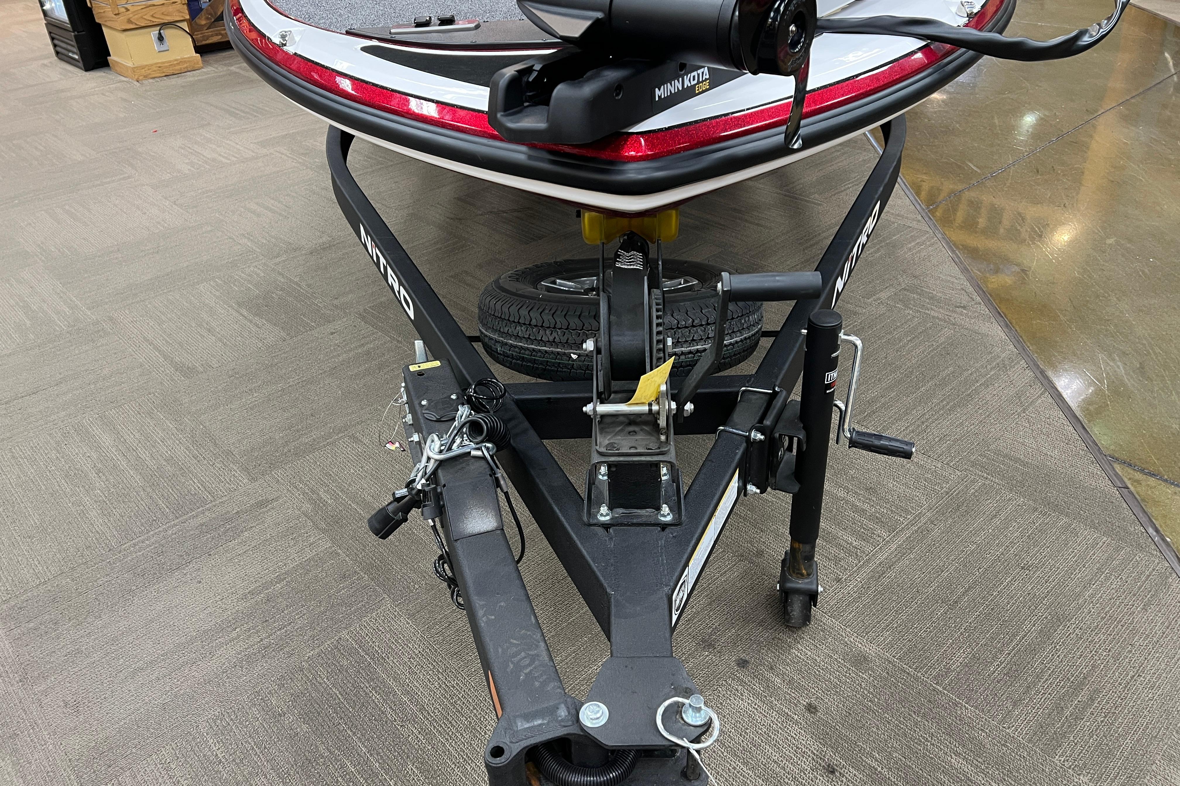 Front view of a 2026 Nitro Z17 boat trailer with hitch and spare tire.