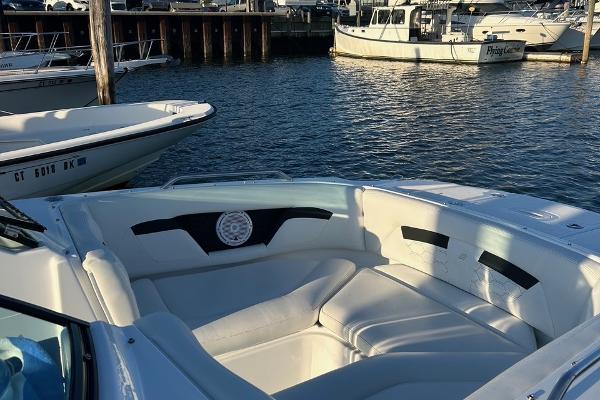 2022 Four Winns HD3 OB RS boat interior at marina, featuring spacious seating.