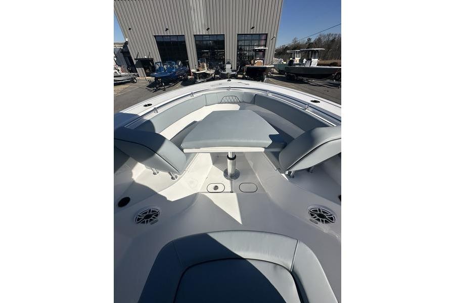 2026 Sportsman Open 282 Center Console boat interior with seating and table.