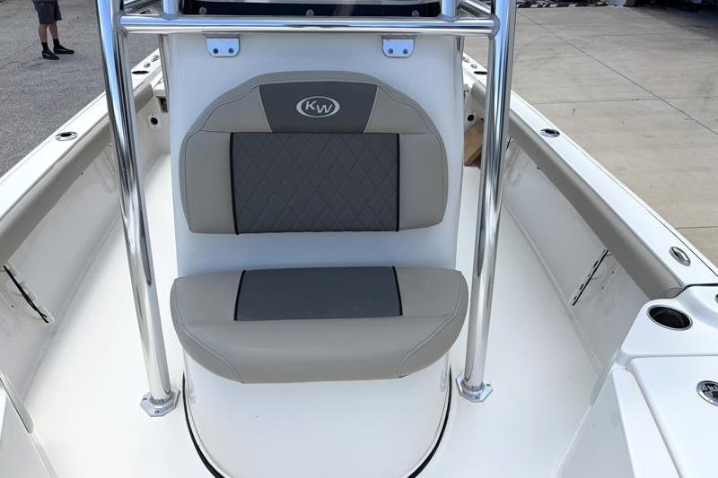 2025 Key West 210 Bay Reef boat seat with gray cushioning and stainless steel railing.