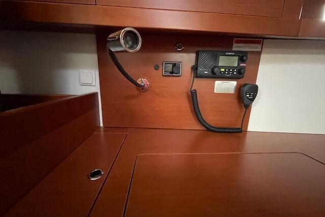 Interior of 2018 Beneteau Oceanis 45 yacht with radio and wood finish.
