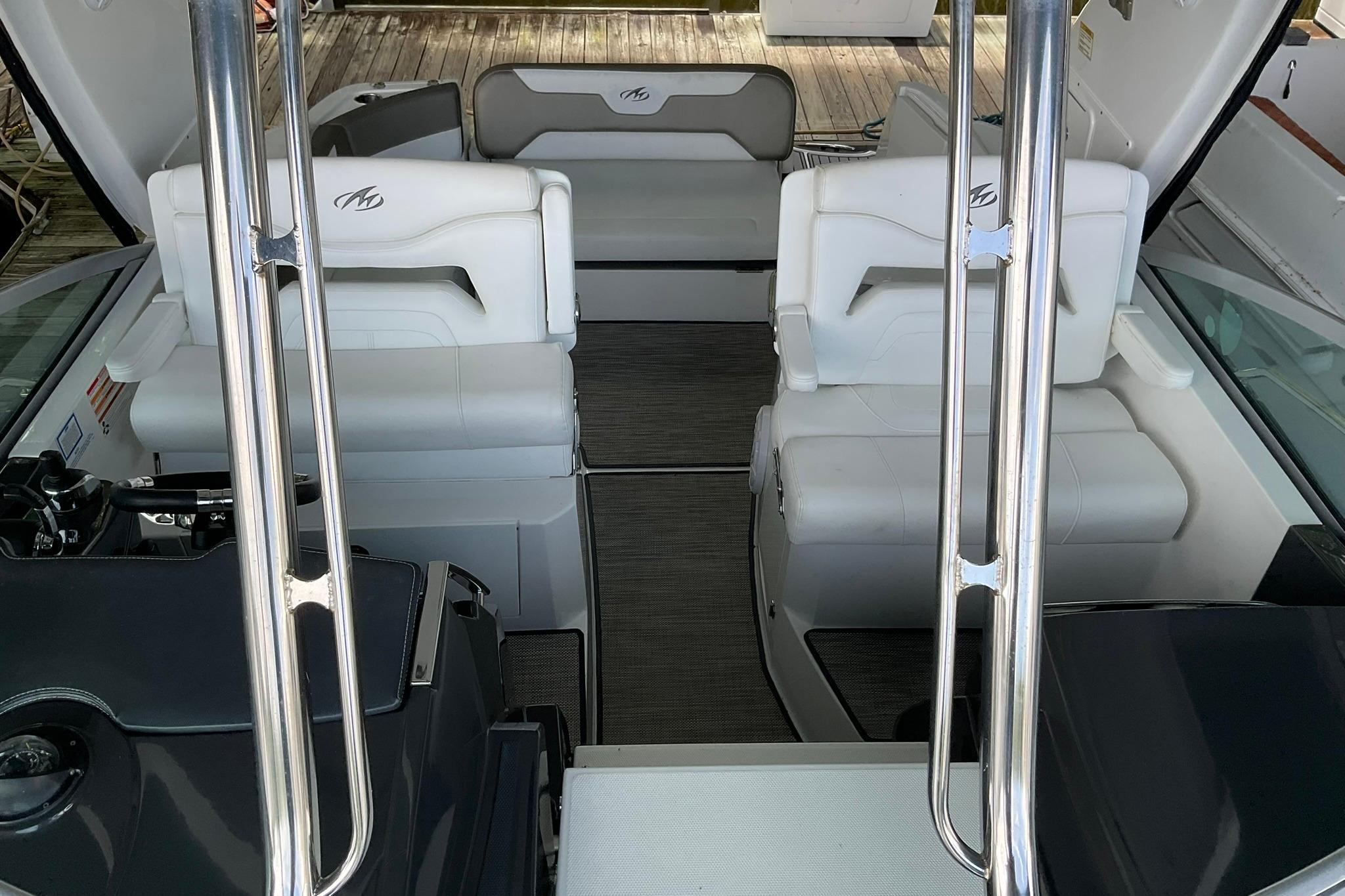 2019 Monterey 335 Sport Yacht interior with white seating and sleek design.