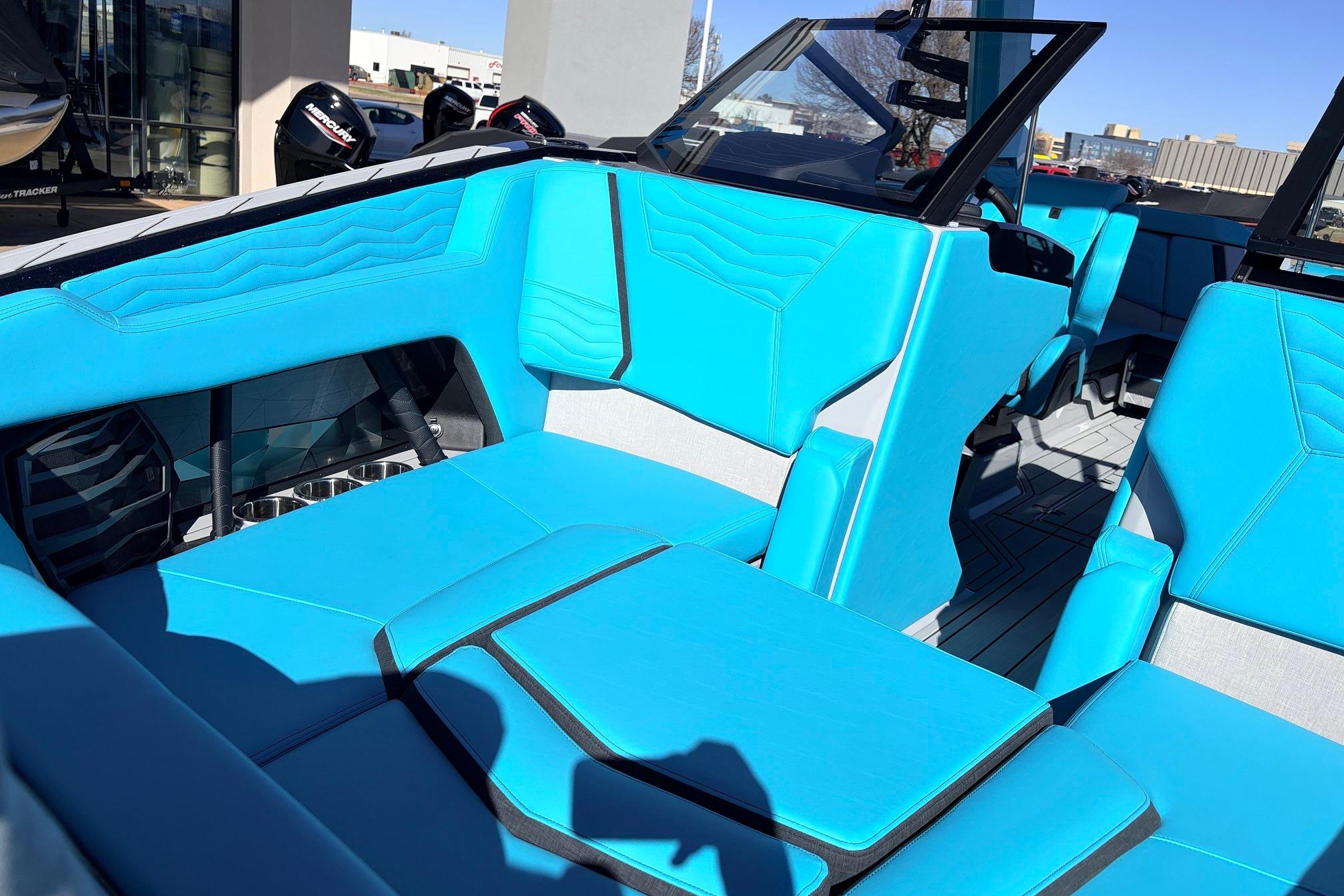 2026 Nautique Super Air Nautique G23 interior with vibrant blue seating and modern design.