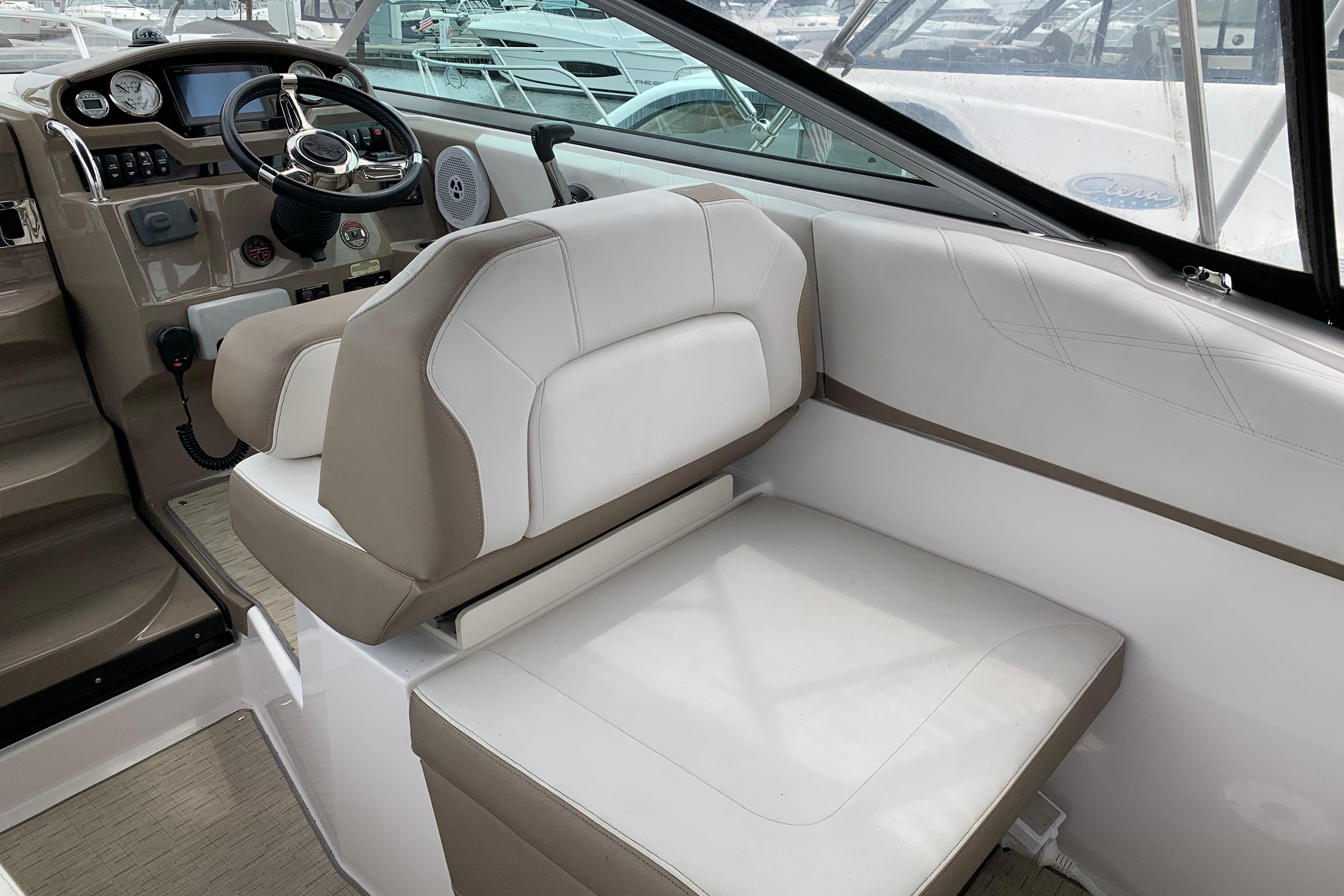 2017 Regal 26 Express boat interior with steering wheel and seating area.