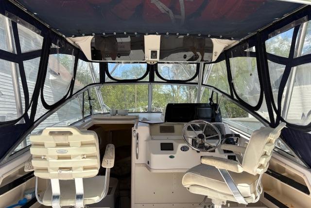 Interior view of a 2003 Grady-White Marlin 300 boat cockpit with seating and controls.