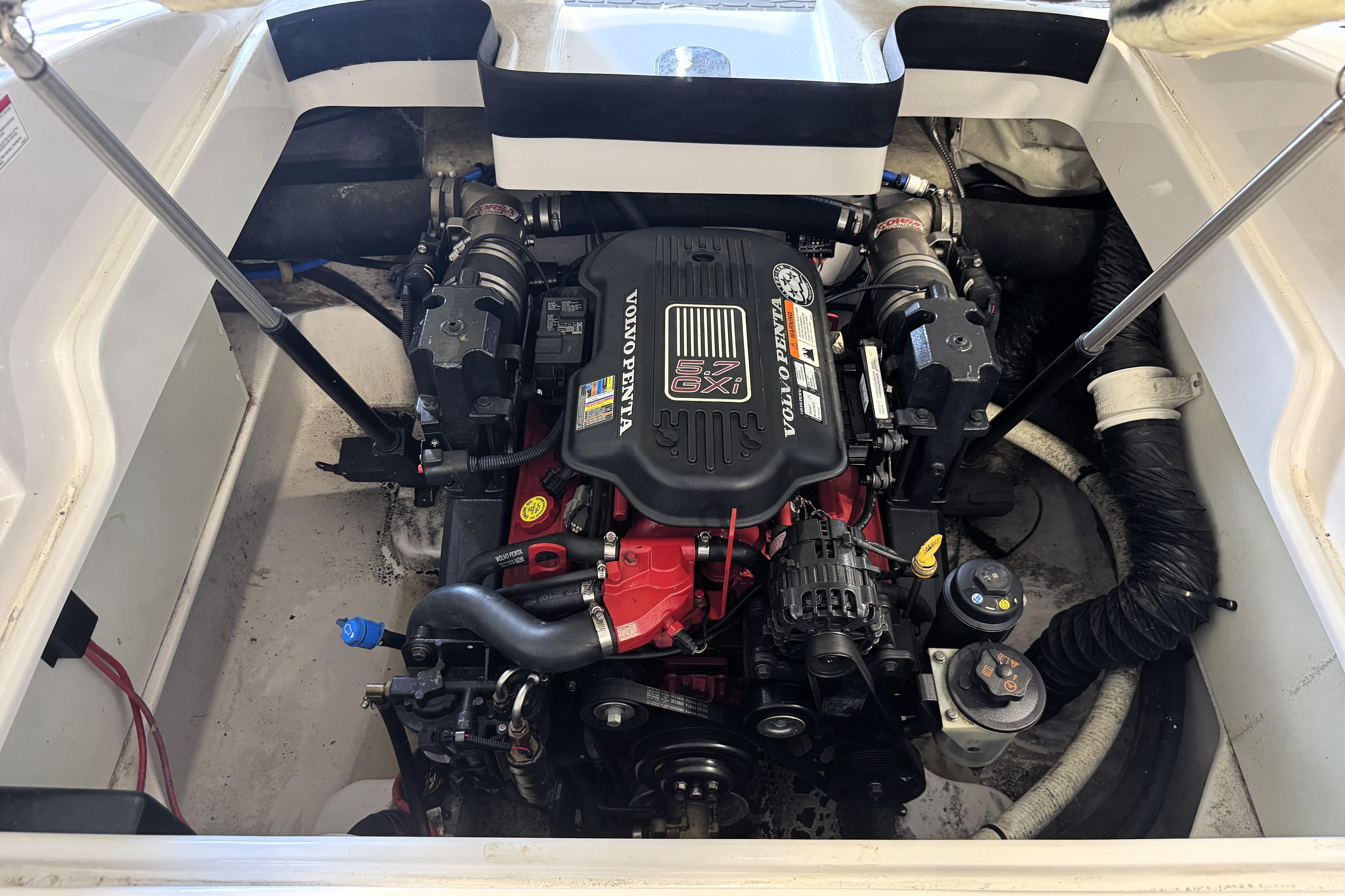 Engine compartment of a 2008 Four Winns H240 boat with Volvo Penta 5.7 GXI engine.