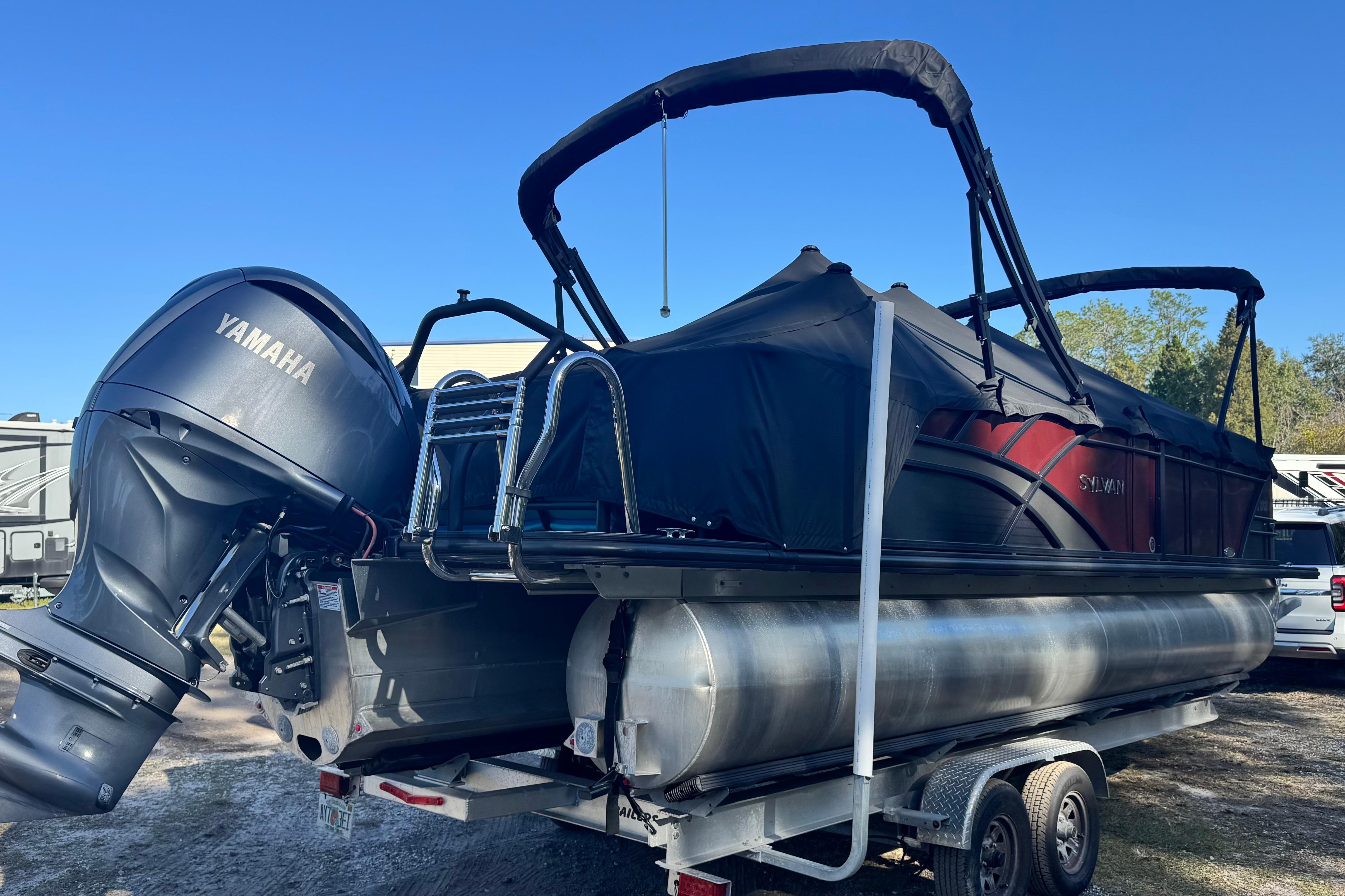 2023 Sylvan L5 CLZ pontoon boat with Yamaha outboard motor on trailer.