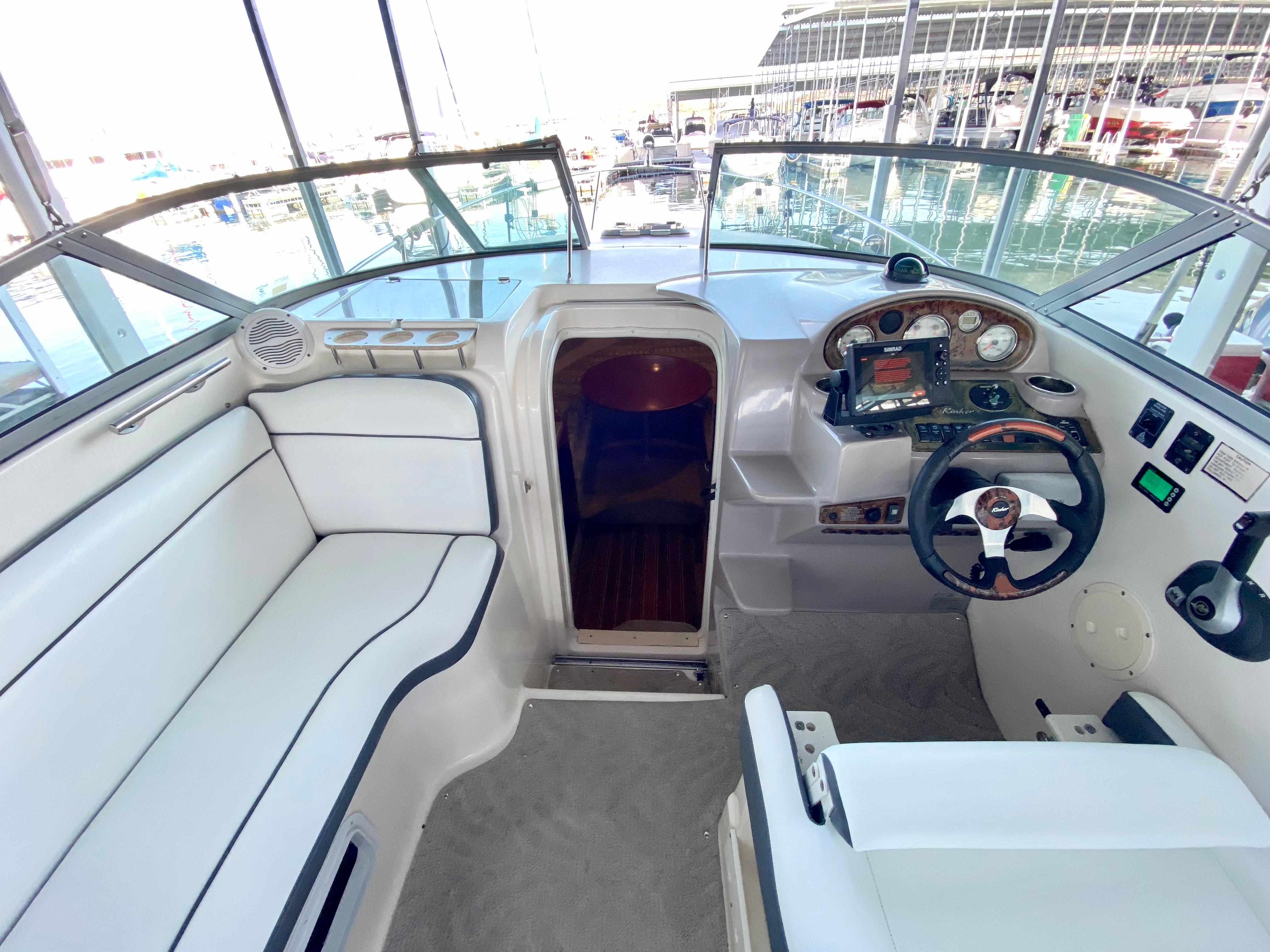 Interior of 2005 Rinker 270 Express Cruiser with helm station.