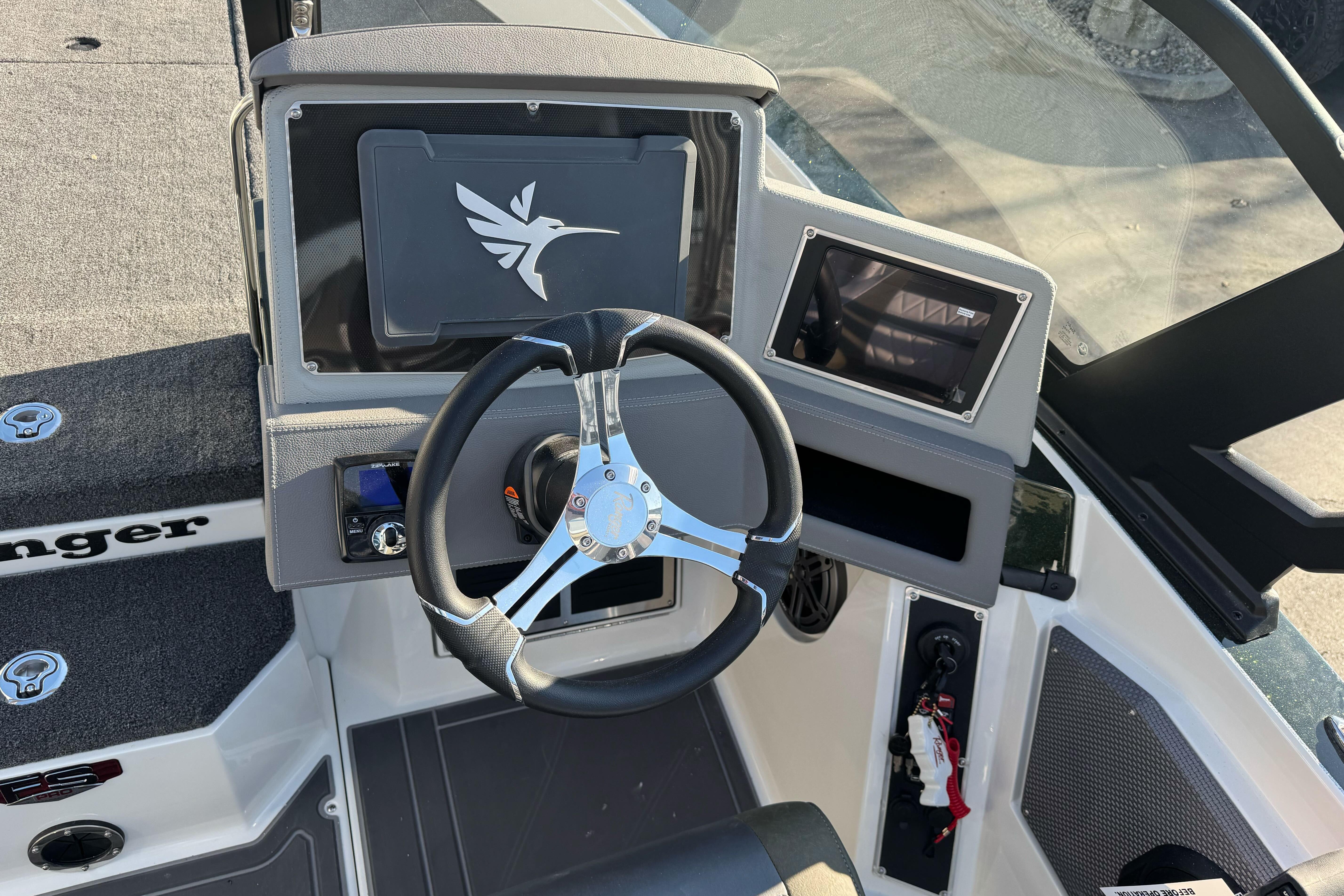 2026 Ranger 620xFS Pro boat dashboard with steering wheel and control panel.