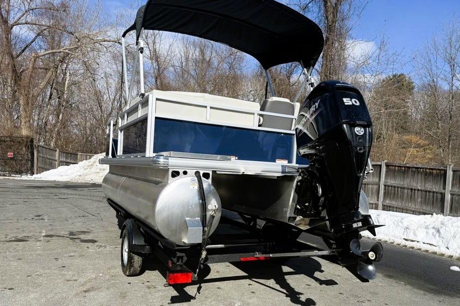 2026 Sun Tracker Bass Buggy 16 XL Select pontoon boat with Mercury 50 engine.