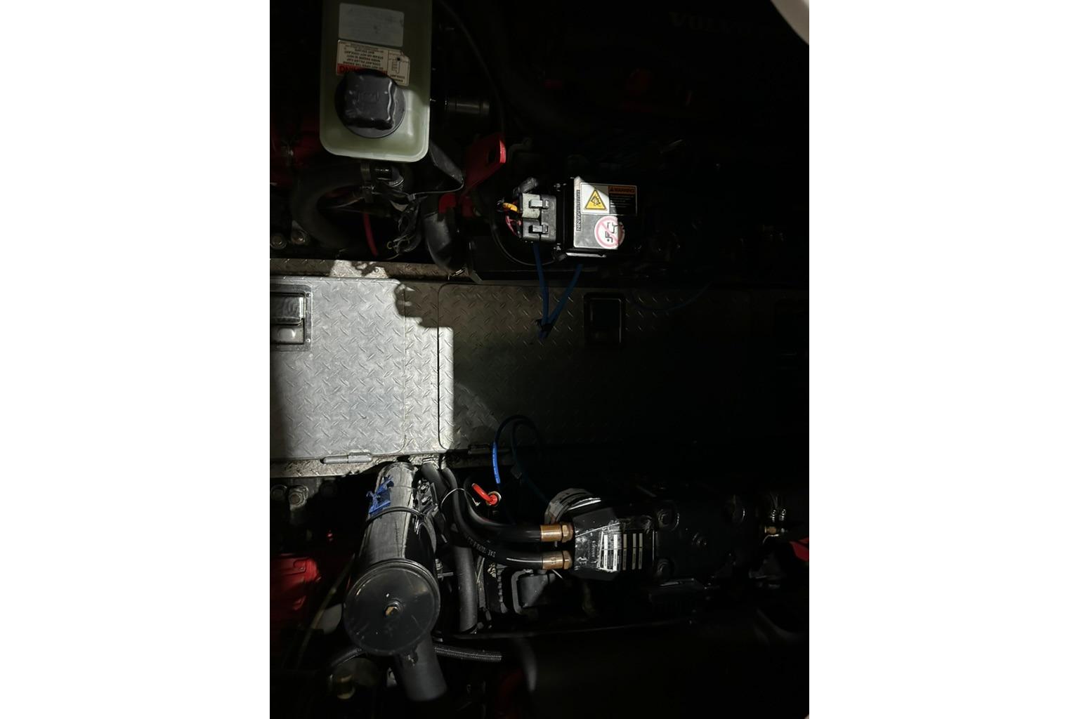 Engine compartment of 2002 Four Winns 378 Vista boat, showcasing mechanical components.