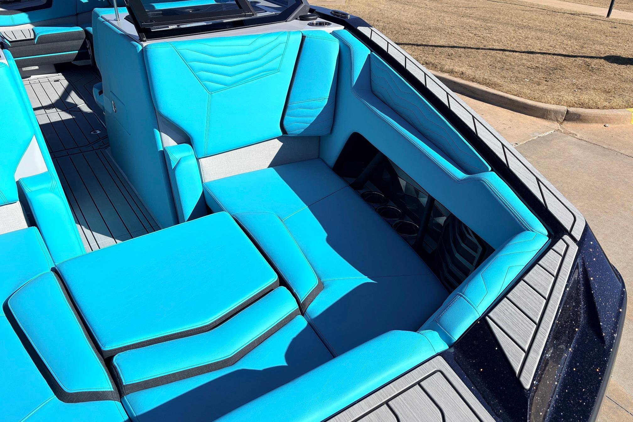 2026 Nautique Super Air Nautique G23 boat interior with vibrant blue seating.