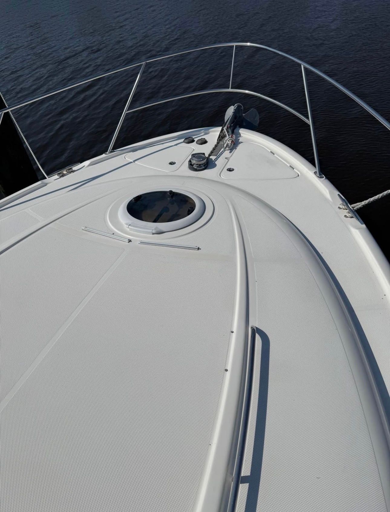 2007 Meridian 411 Sedan boat deck on calm water.