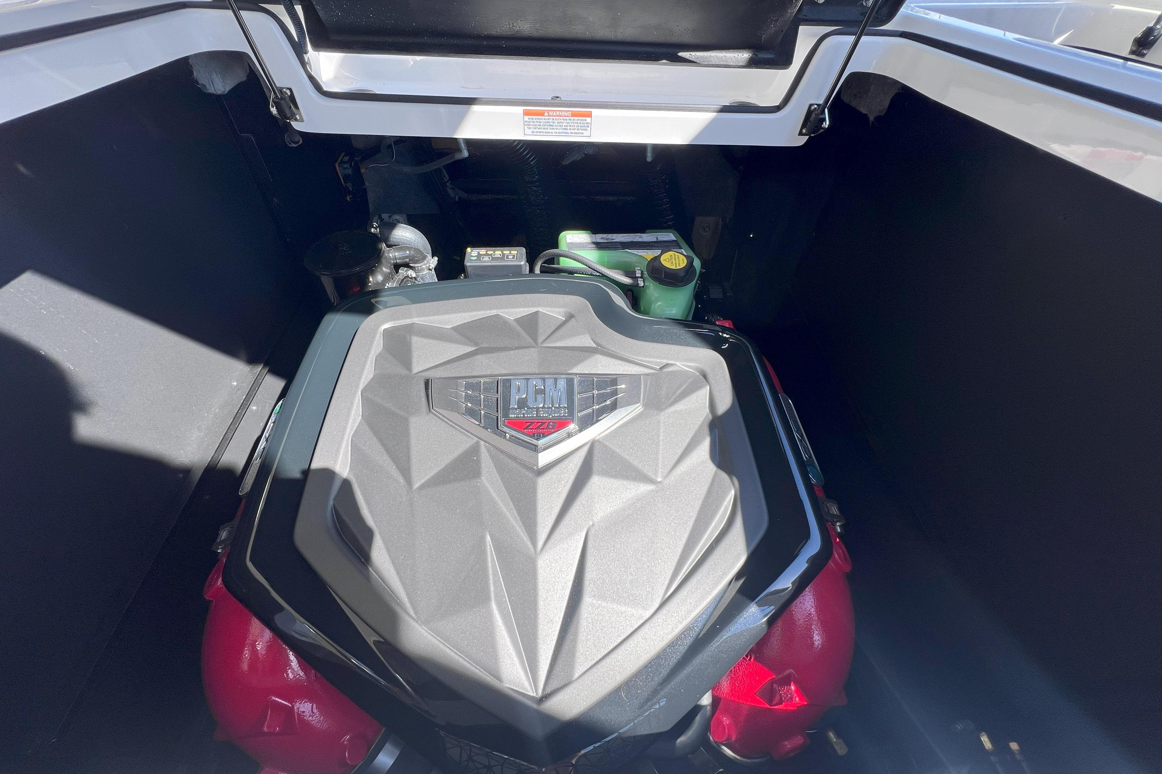 2025 Nautique Super Air Nautique G21 engine compartment with PCM engine cover.