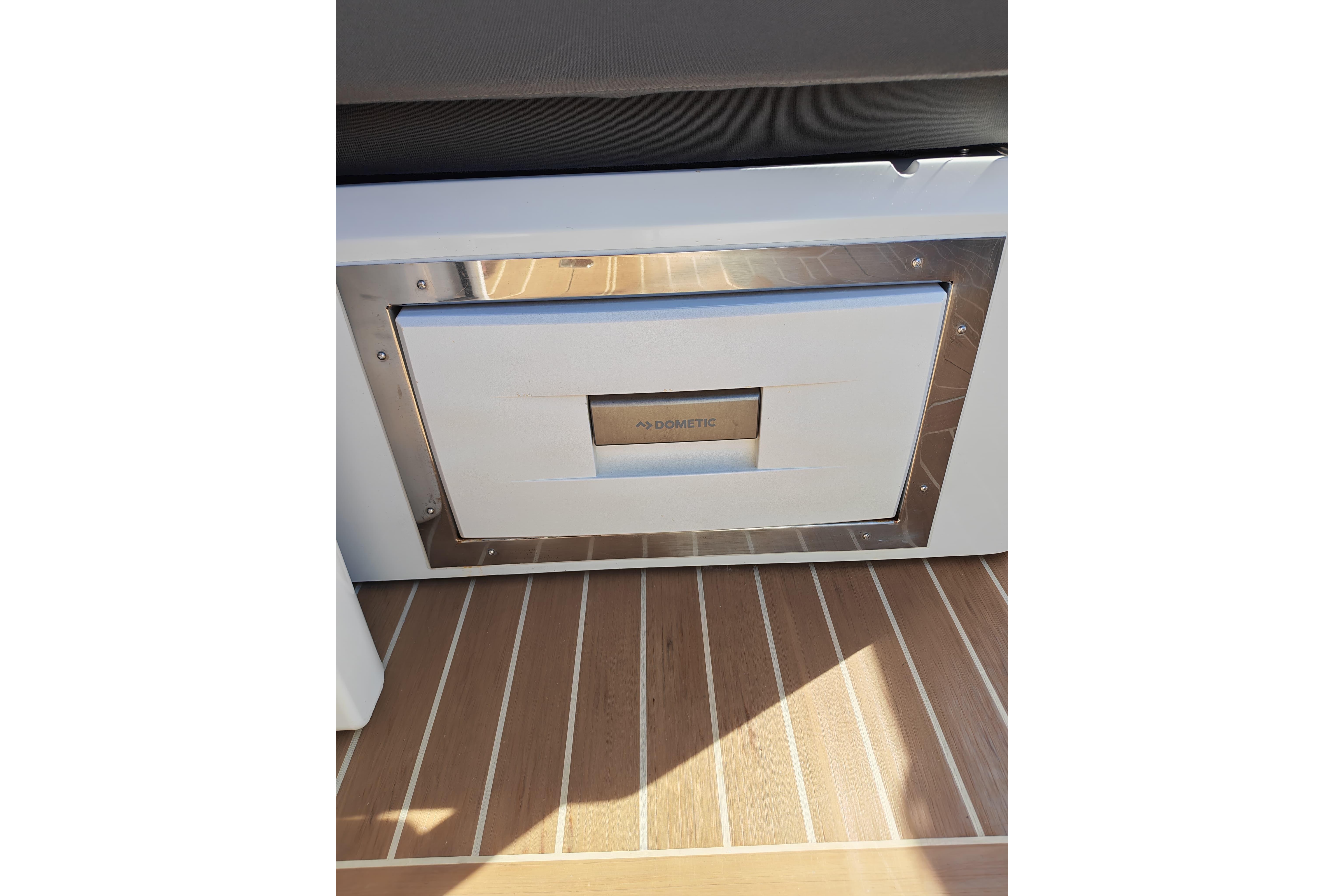 Built-in Dometic appliance on 2015 Fjord 40 Open yacht with wooden flooring.