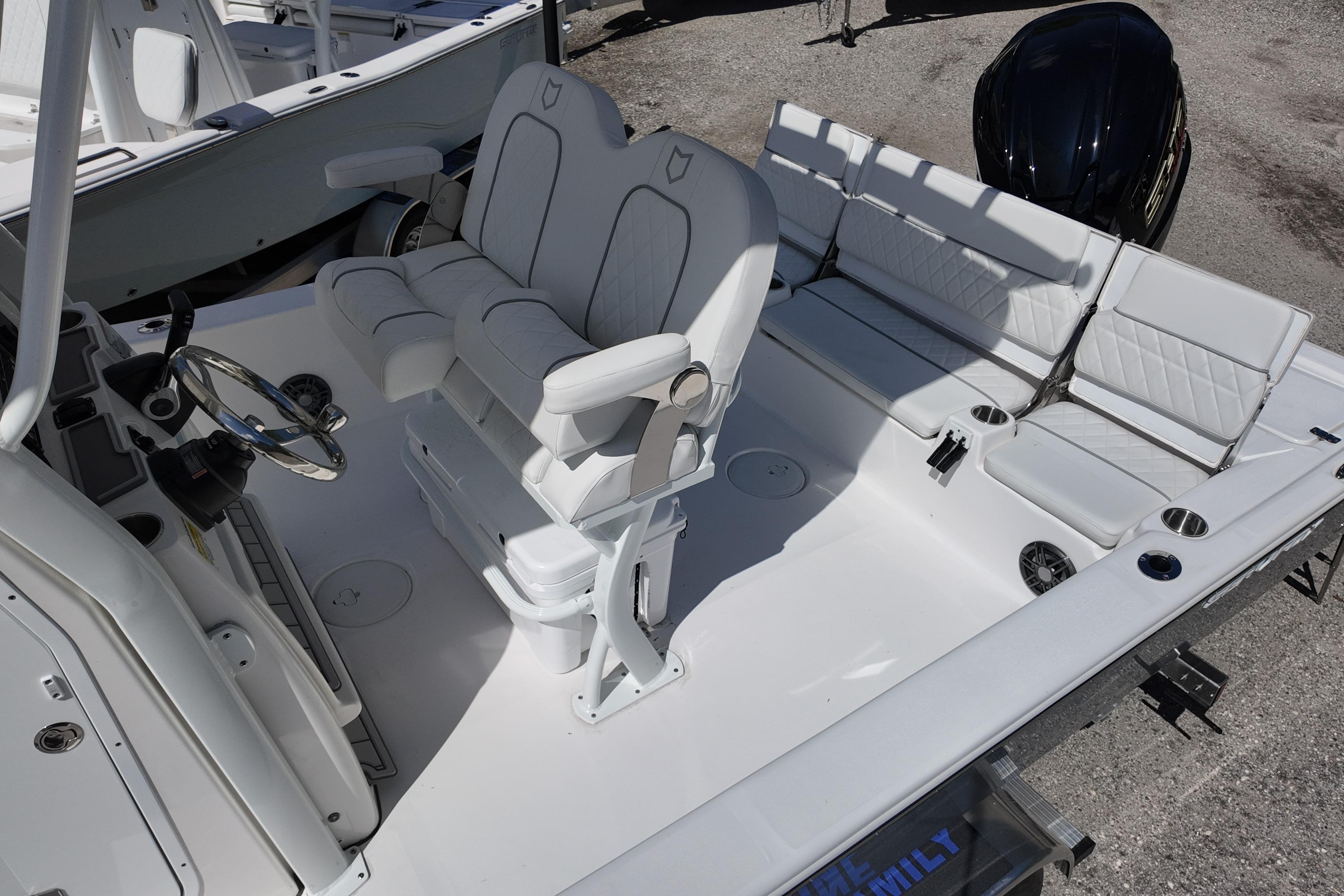 2026 Sea Fox 251 Bay Fox boat interior with white seating and steering wheel.