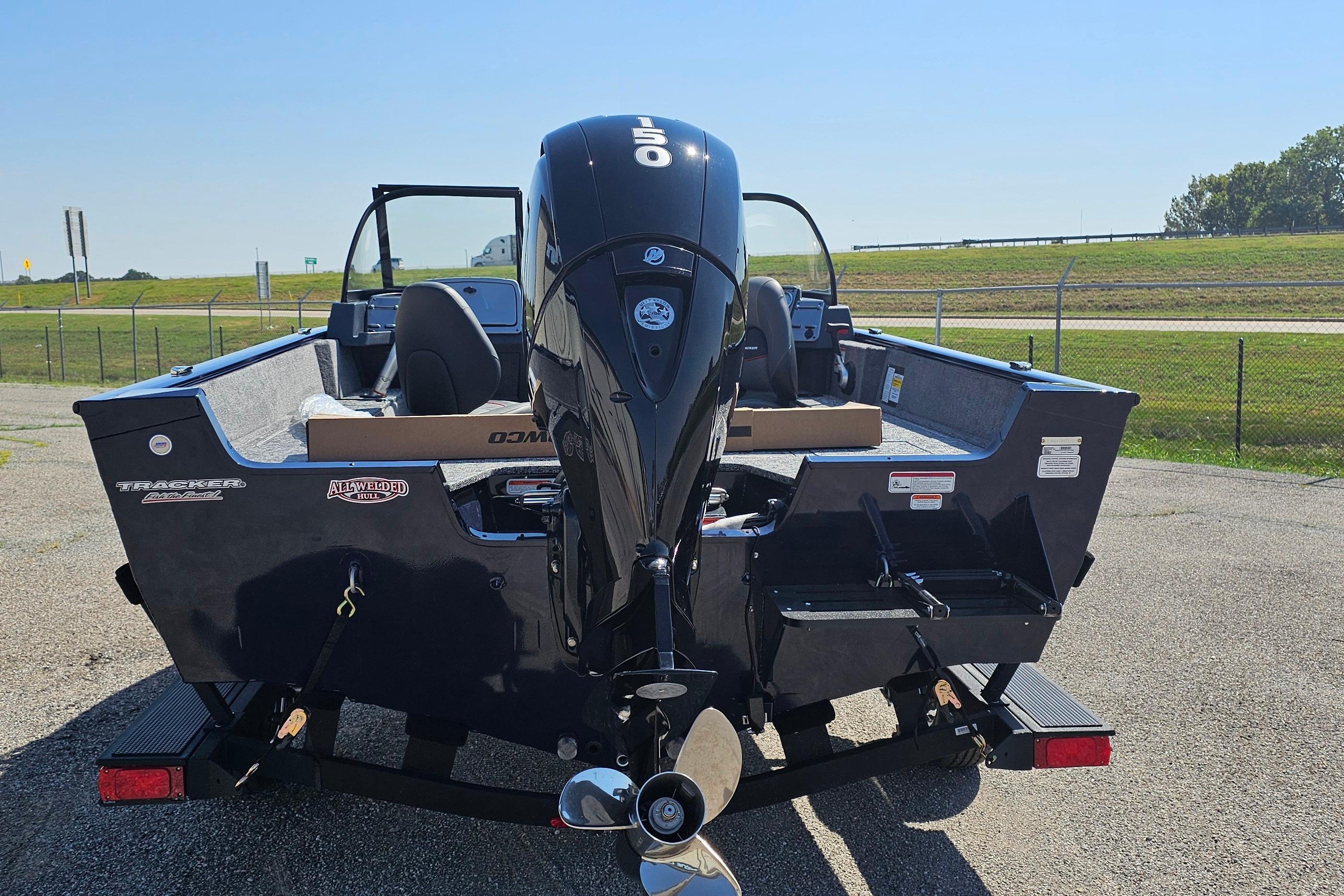 2026 Tracker Pro Guide V-175 Combo boat with outboard motor, parked on a trailer.