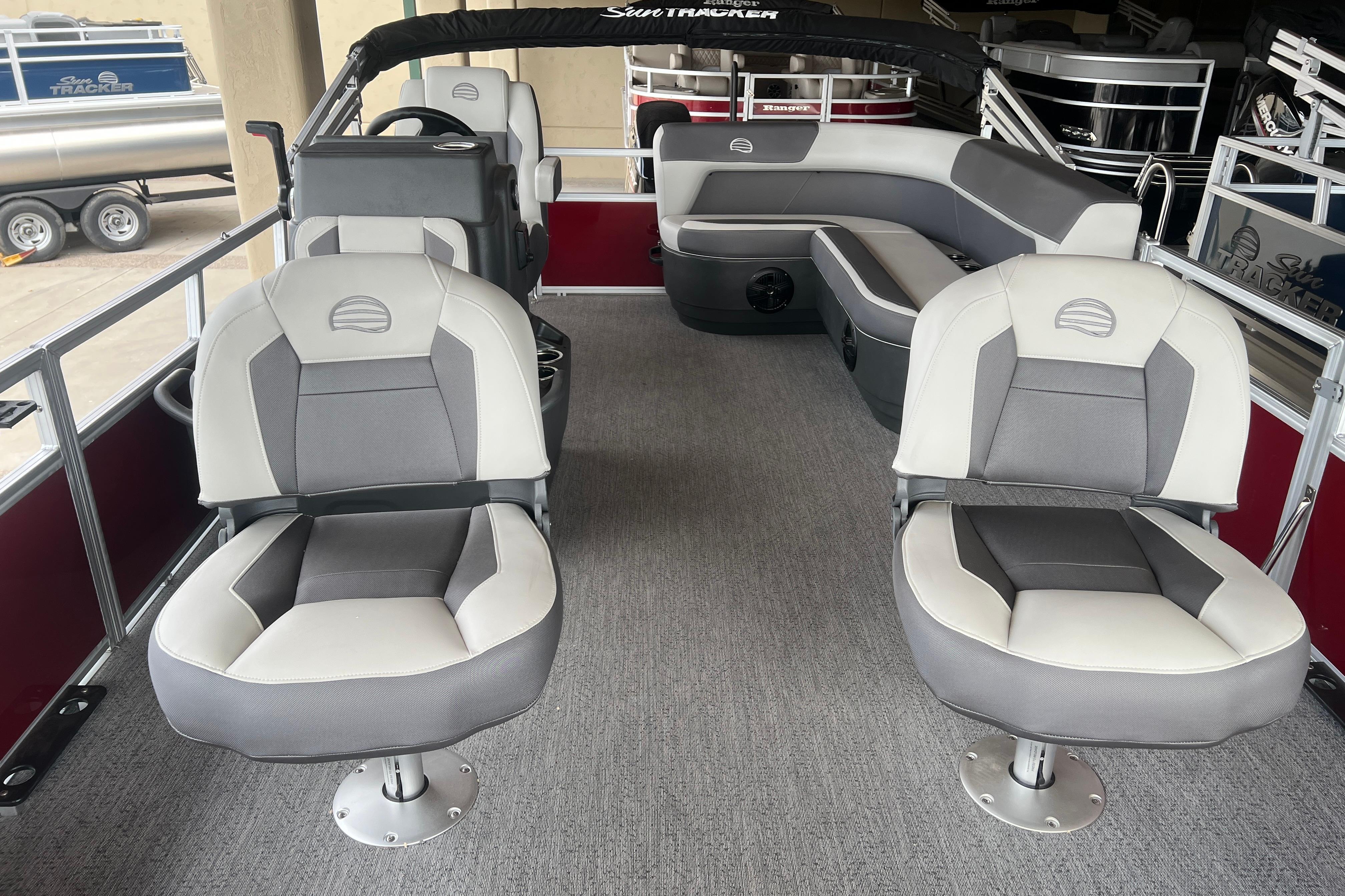 2026 Sun Tracker Bass Buggy 16 XL Select pontoon boat interior with seating and helm.