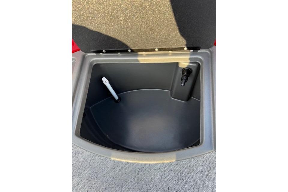 Open storage compartment on 2026 Sun Tracker Fishin' Barge 22 XP3 boat.