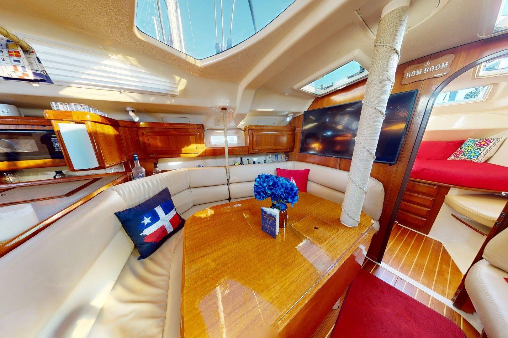 Luxurious interior of a 1997 Hunter Legend 40.5 yacht with elegant wood finishes.