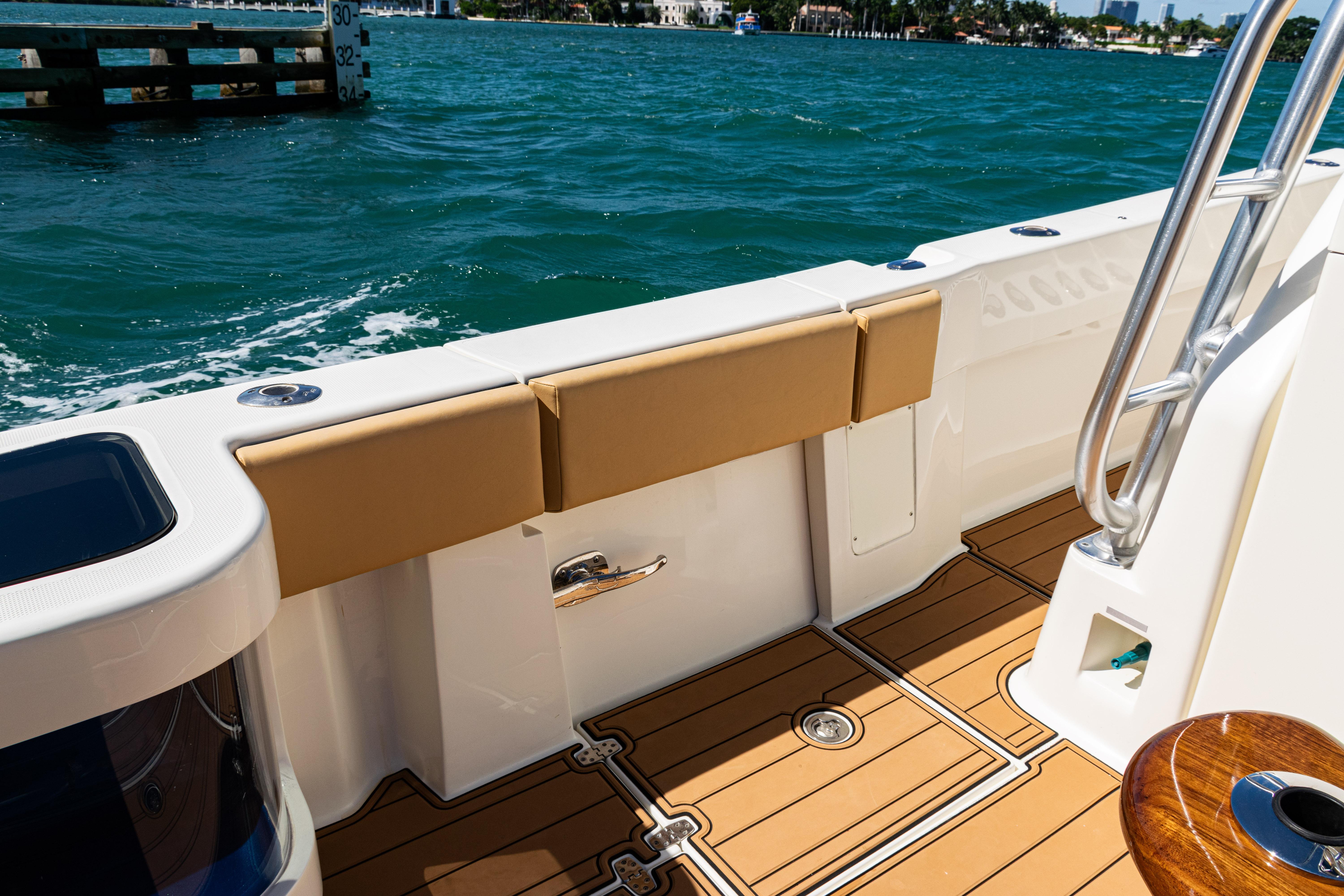 2016 SeaVee 430 boat deck with cushioned seating and ocean view.