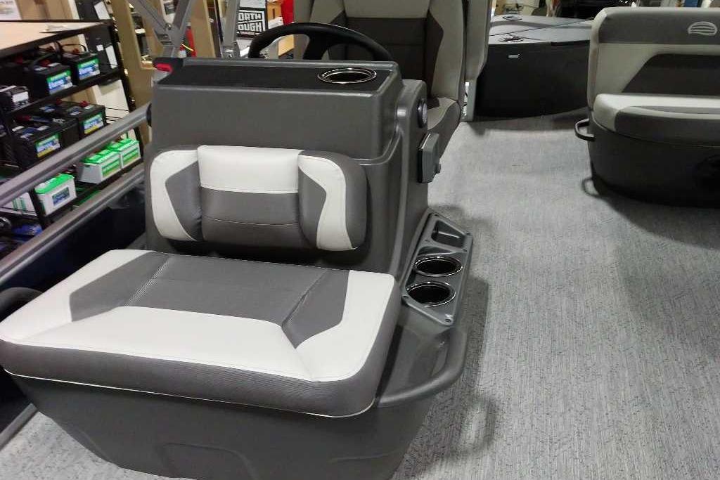 2026 Sun Tracker Bass Buggy 18 DLX interior with gray seating and cup holders.