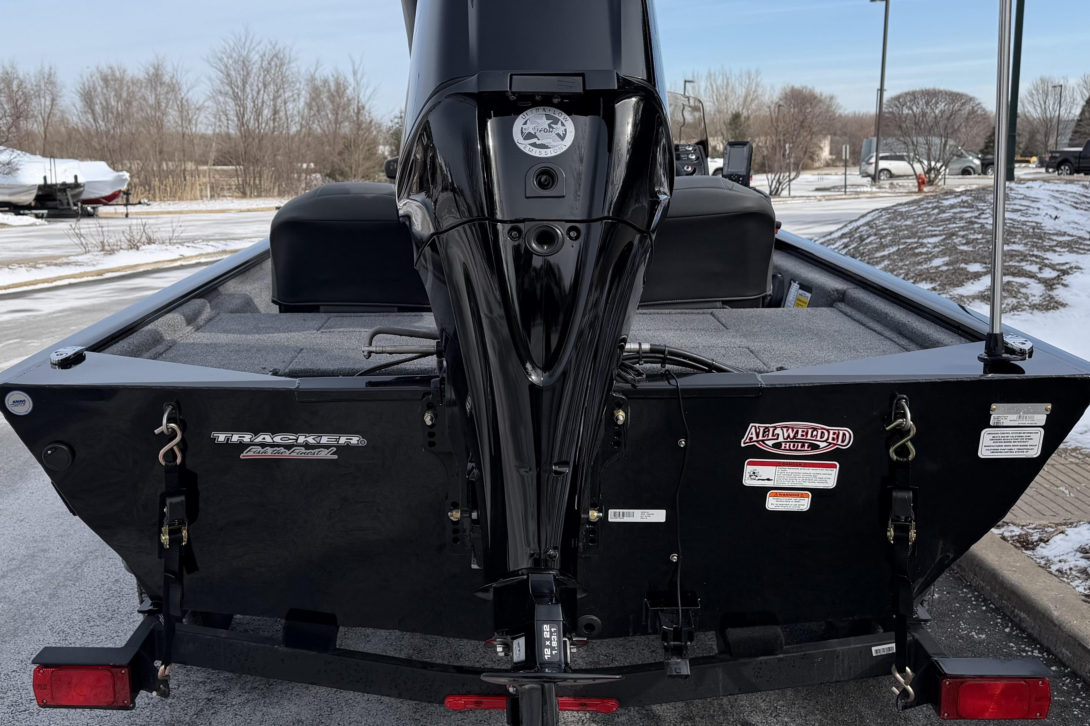 2026 Tracker Pro 170 boat with all-welded hull, rear view in snowy setting.