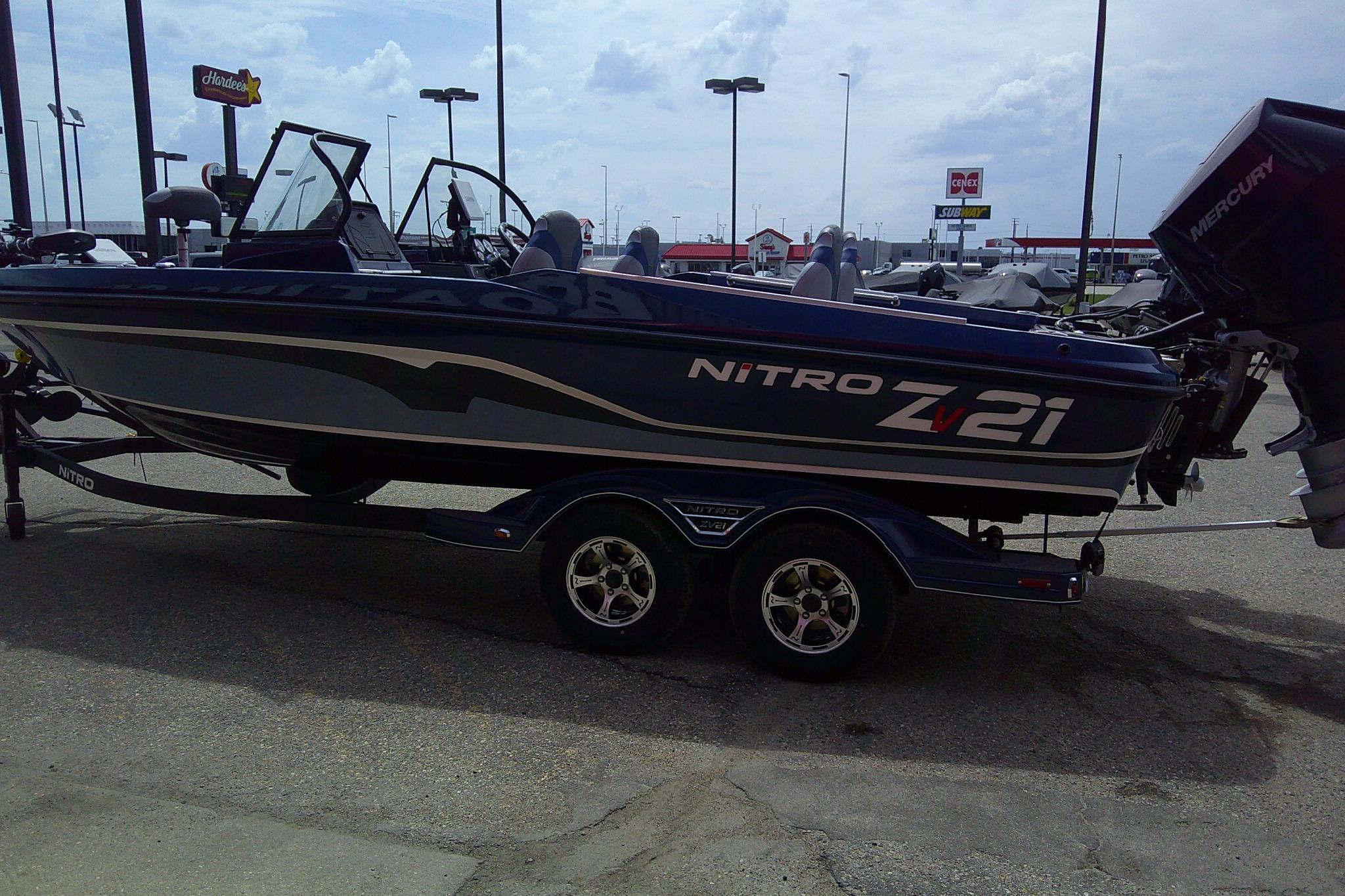 2026 Nitro ZV21 Pro boat on trailer in parking lot.