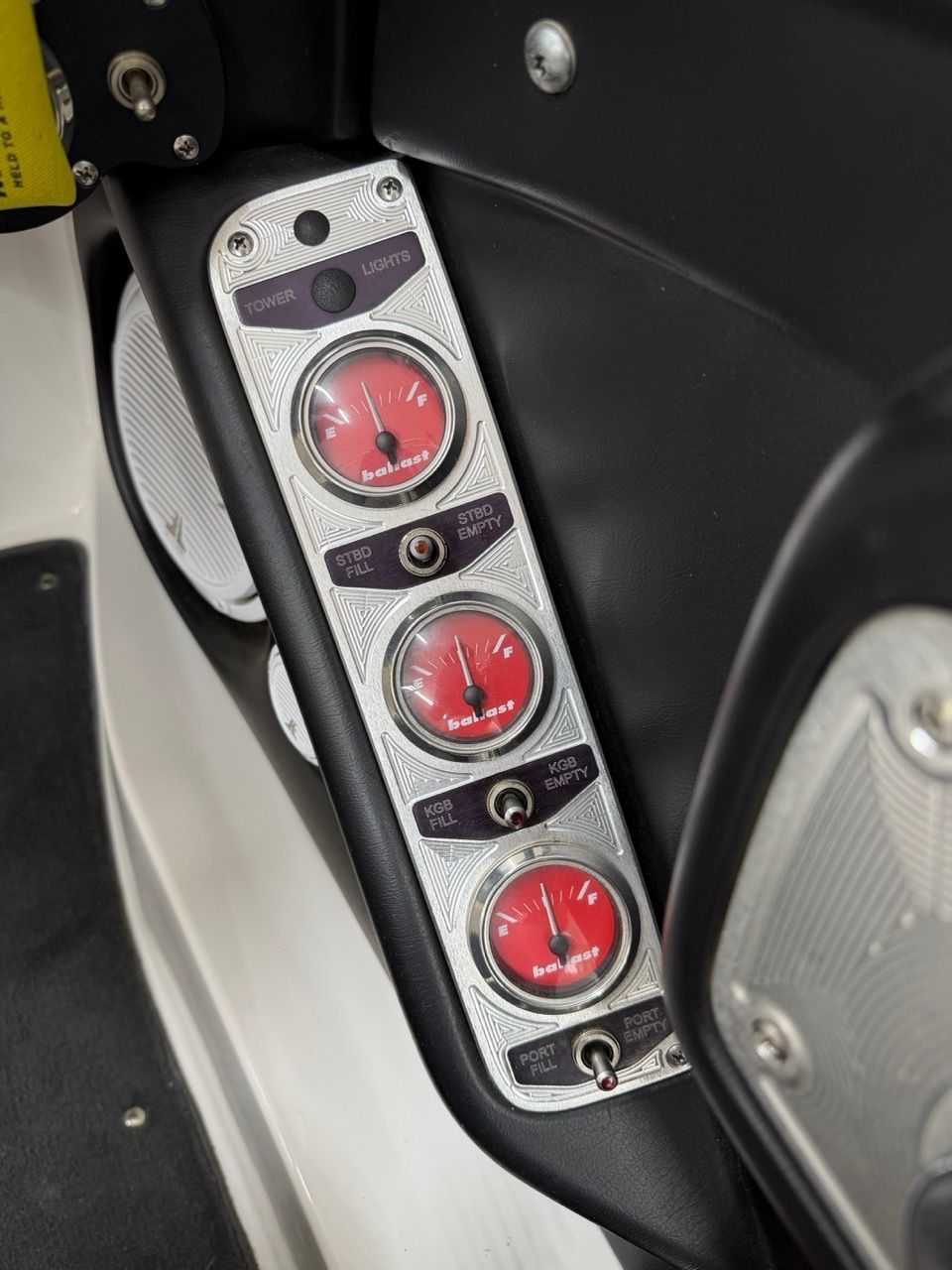 Dashboard of a 2006 MasterCraft X30 with four red gauges.