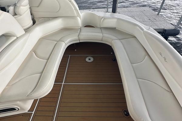 2004 Sea Ray 380 Sundancer boat with white seating and teak deck.