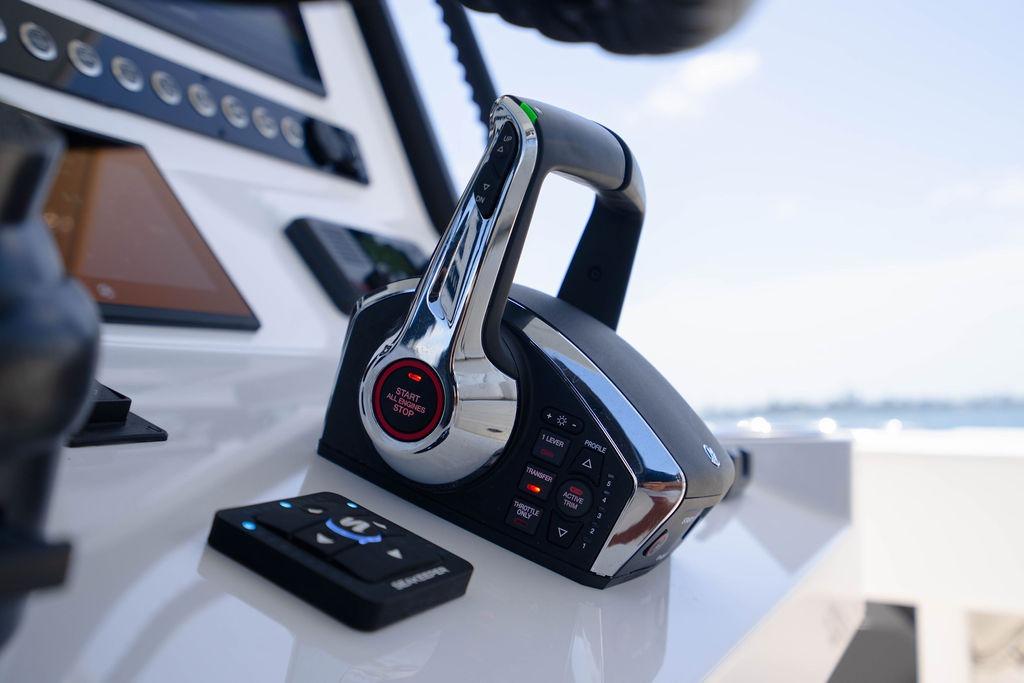 Control panel of 2027 Reef Runner 340 boat, featuring advanced throttle and navigation controls.