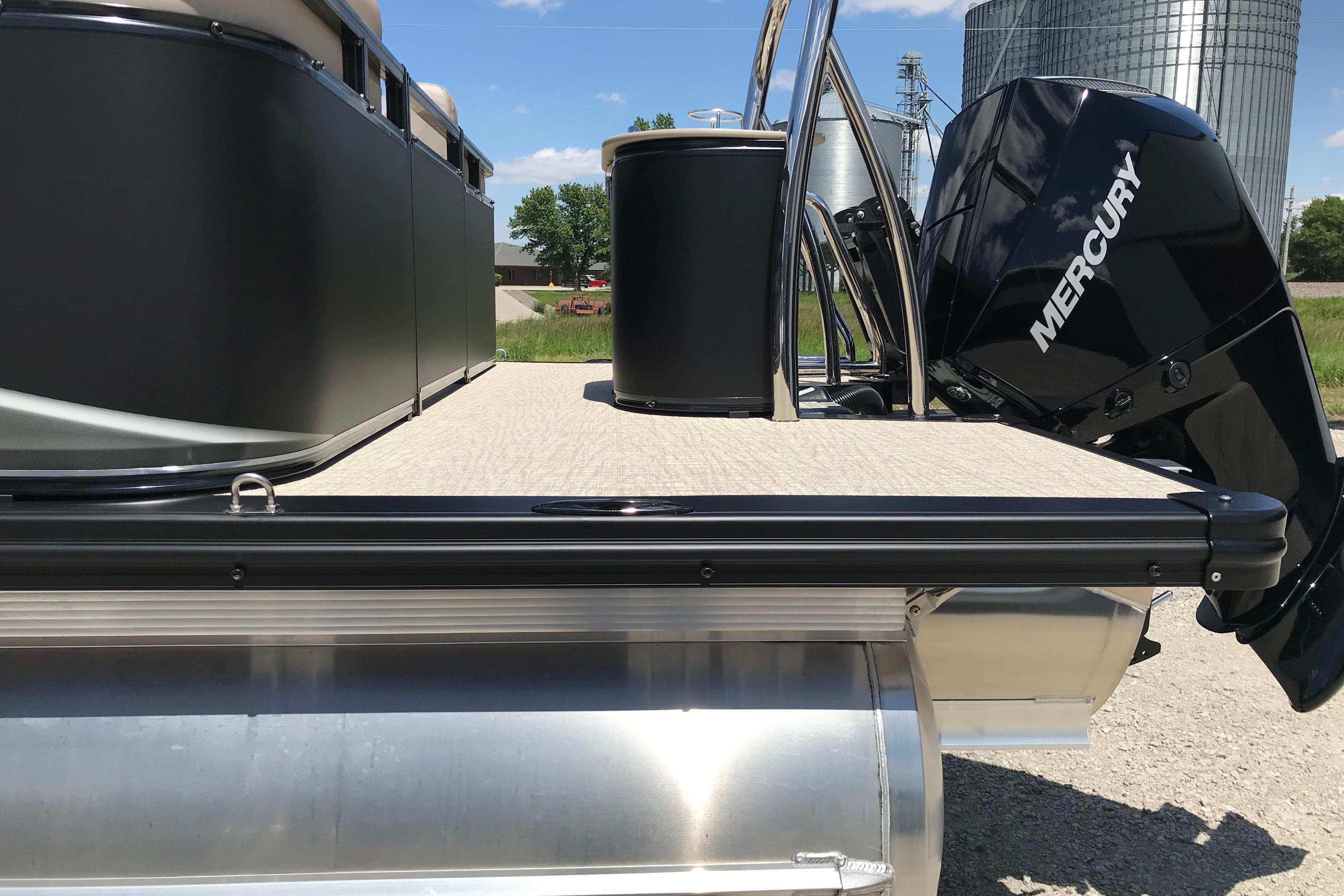 2026 Avalon LSZ Quad Lounge Tri Log pontoon boat with Mercury outboard motor.
